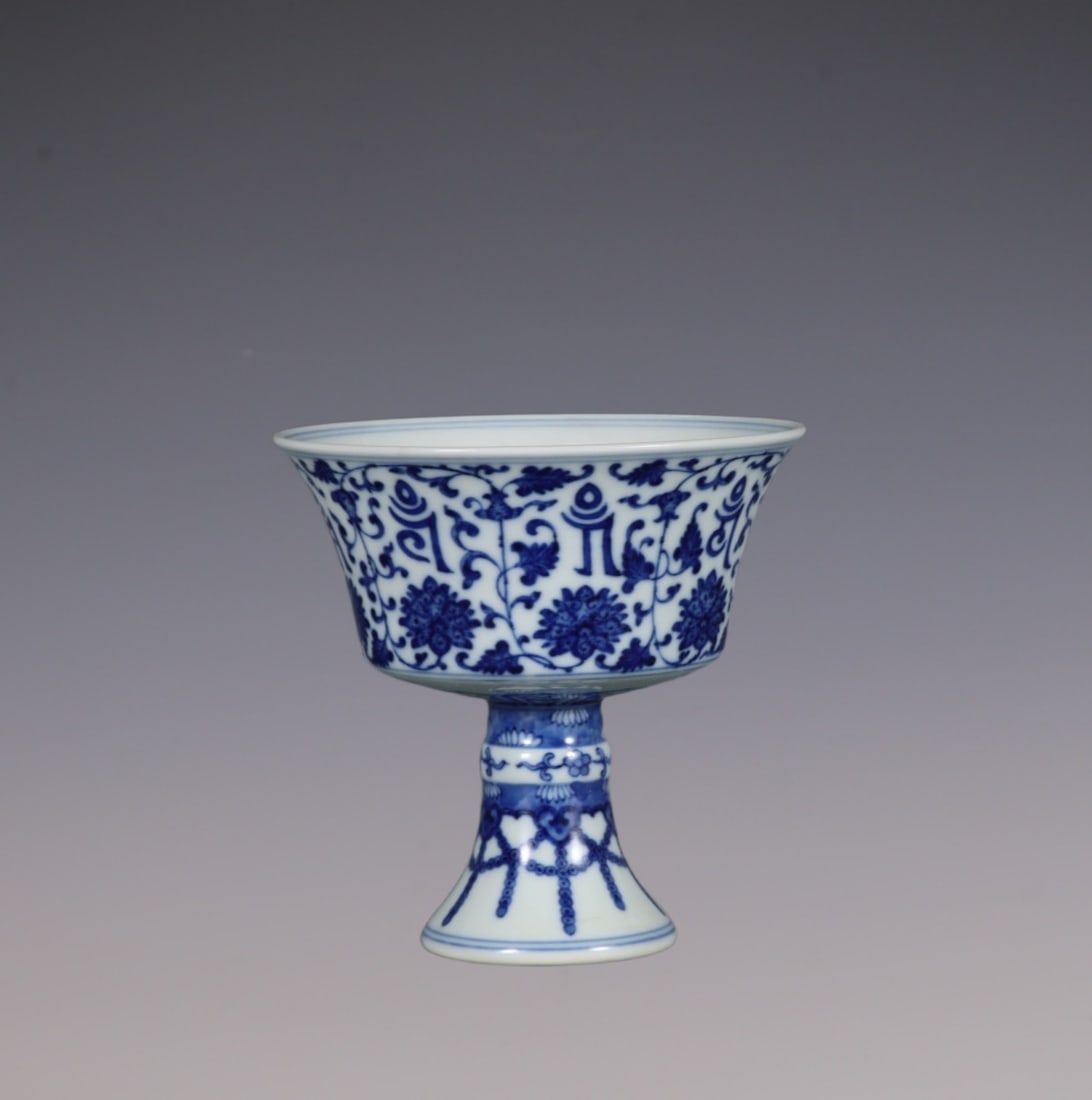 An Exquisite Blue and White Lotus Pattern With Sanskrit Cup: An Exquisite Blue and White Lotus Pattern With Sanskrit Cup Qing Dynasty, China Qianlong Six-character Mark Size:10.8cmx11.2cm (The Dimensions Of All Batches Are Manually Measured.If You Need More