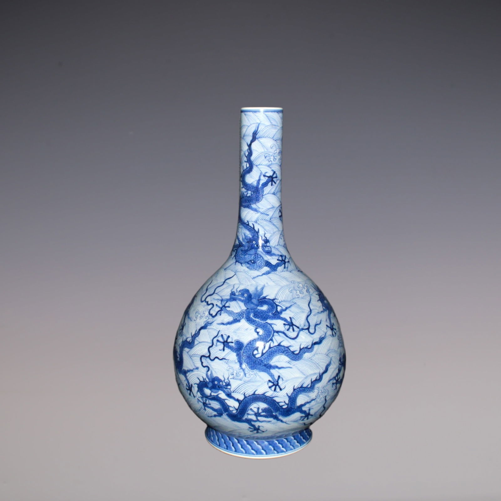 An Exquisite Blue and White Dragon Pattern Seawater Pattern Vase: An Exquisite Blue and White Dragon Pattern Seawater Pattern Vase Qing Dynasty, China Yongzheng Six-character Mark Size:39cmx13cm (The Dimensions Of All Batches Are Manually Measured.If You Need More D