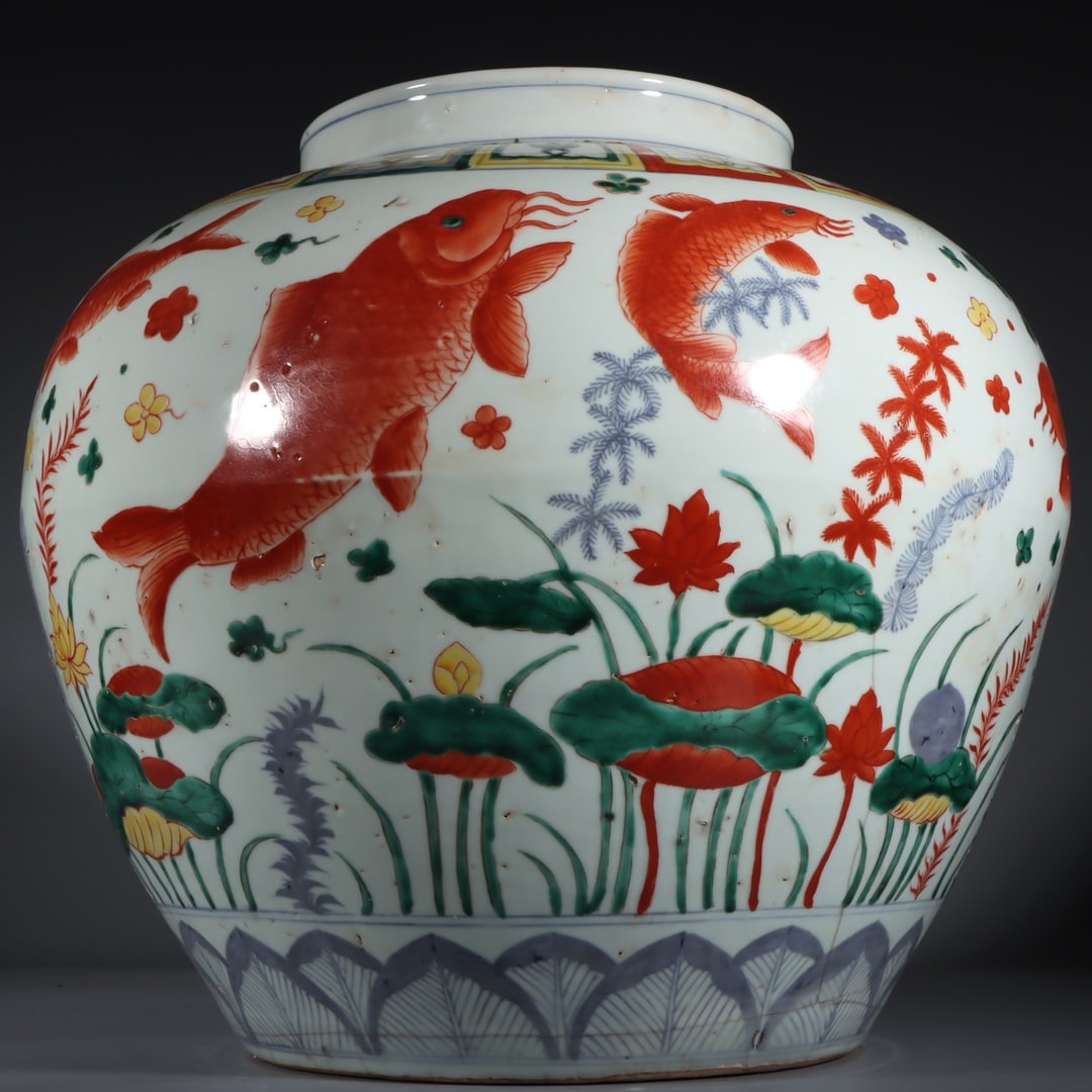 An Exquisite Wucai Fish and Lotus Pattern Jar: An Exquisite Wucai Fish and Lotus Pattern Jar Ming Dynasty, China Wanli Six-character Mark Size:35.5cmx40cm (The Dimensions Of All Batches Are Manually Measured.If You Need More Detailed