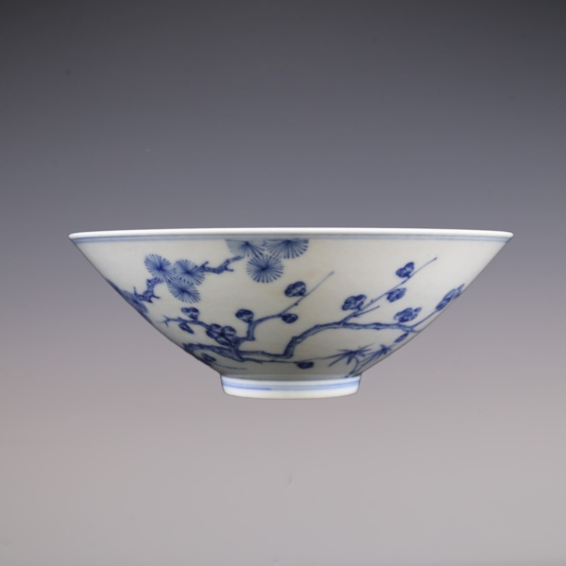 An Exquisite Blue and White Pine, Bamboo and Plum Blossom Pattern Bowl: An Exquisite Blue and White Pine, Bamboo and Plum Blossom Pattern Bowl Qing Dynasty, China Yongzheng Six-character Mark Size:20cmx7cm (The Dimensions Of All Batches Are Manually Measured.If You
