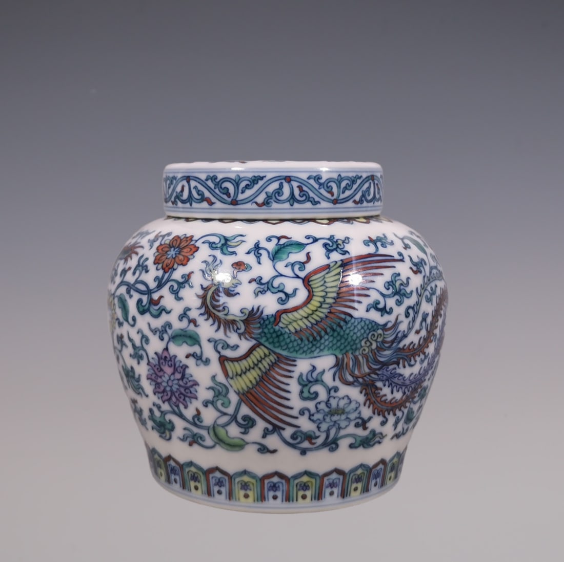 An Exquisite Doucai Blue and White Lotus Pattern Dragon and Phoenix Pattern Tea Caddy: An Exquisite Doucai Blue and White Lotus Pattern Dragon and Phoenix Pattern Tea Caddy Qing Dynasty, China Yongzheng Six-character Mark Size:11.8cmx13cm (The Dimensions Of All Batches Are Manually