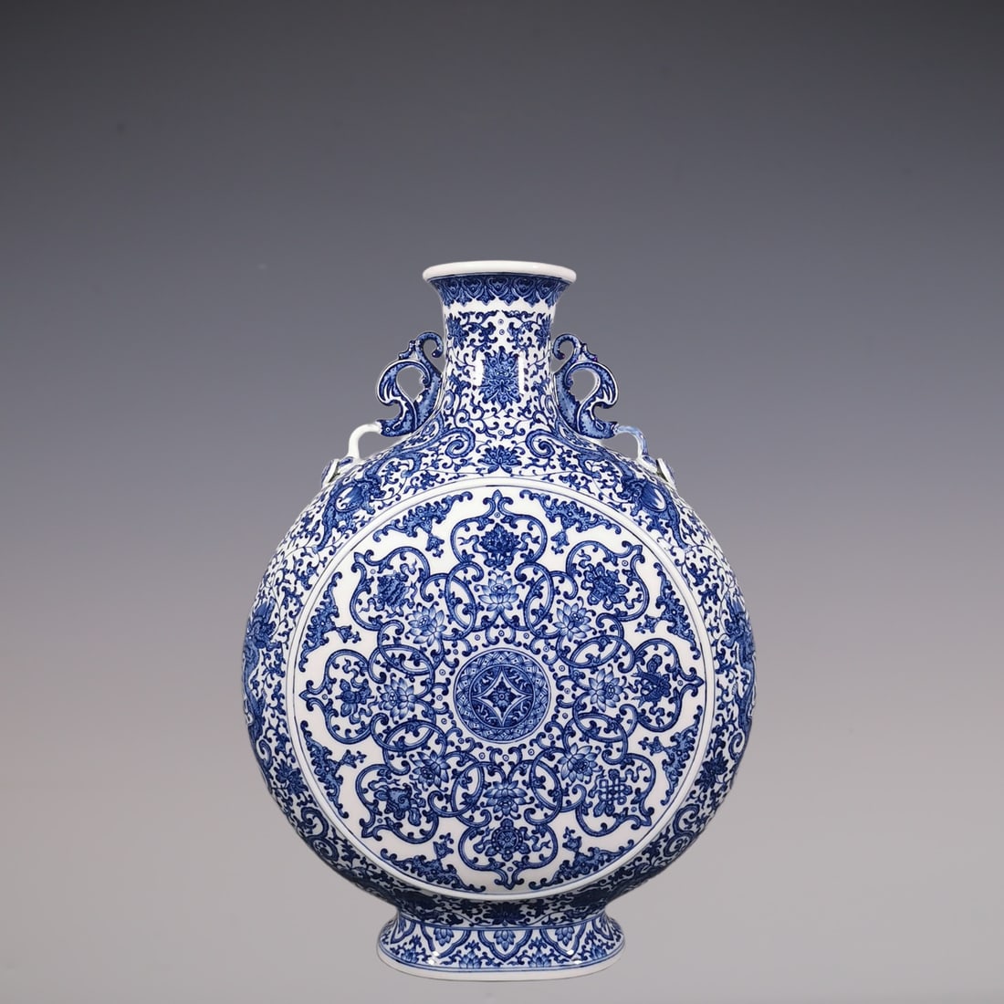 An Exquisite Blue and White Lotus Pattern Dragon Pattern Eight Treasures Pattern Double-Ears Vase: An Exquisite Blue and White Lotus Pattern Dragon Pattern Eight Treasures Pattern Double-Ears Vase Qing Dynasty, China Qianlong Six-character Mark Size:51.5cmx38.5cm (The Dimensions Of All Batches