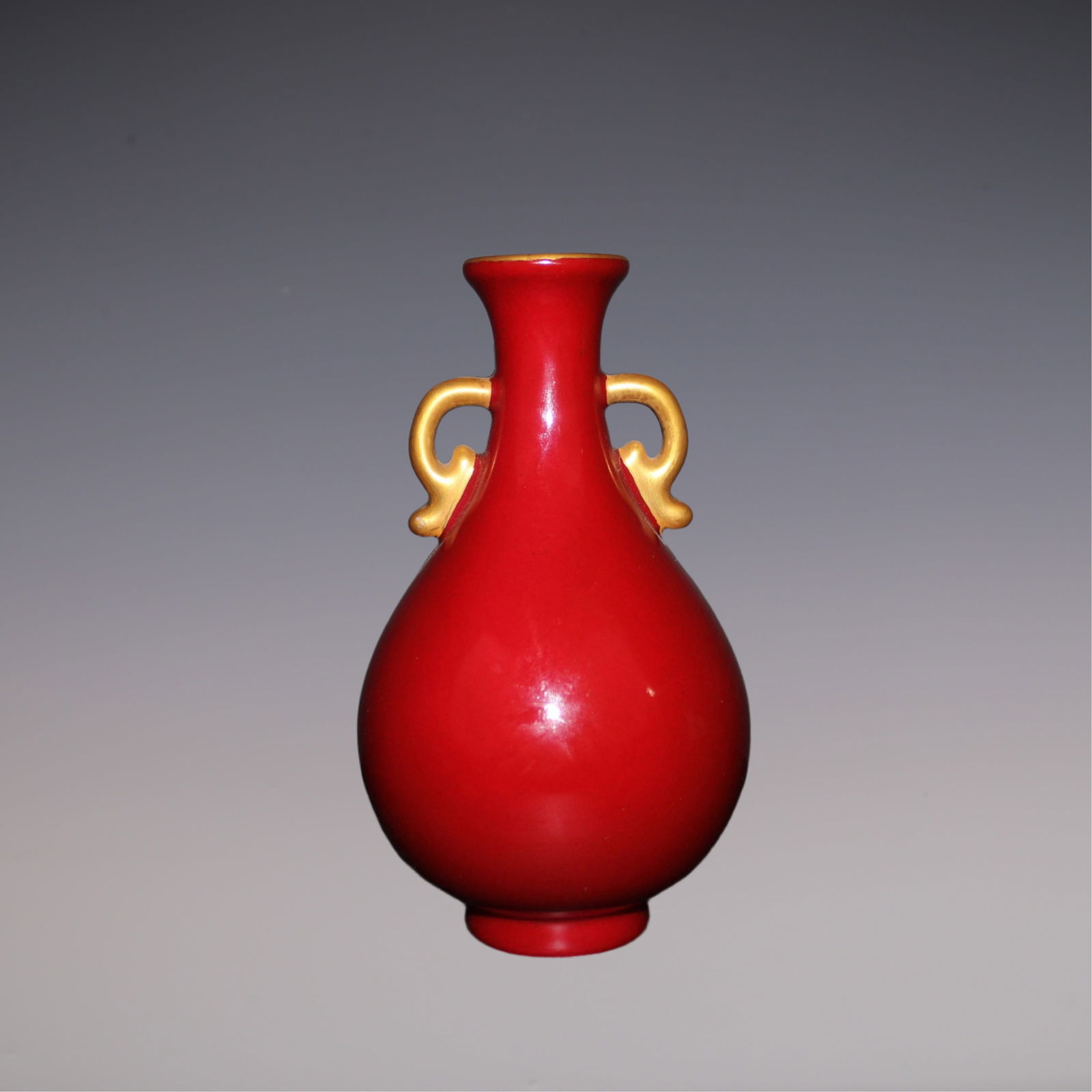 An Exquisite Ruby Red-Glazed Double-Ears Vase: An Exquisite Ruby Red-Glazed Double-Ears Vase Qing Dynasty, China Qianlong Six-character Mark Size:17.5cmx4.5cm (The Dimensions Of All Batches Are Manually Measured.If You Need More Detailed