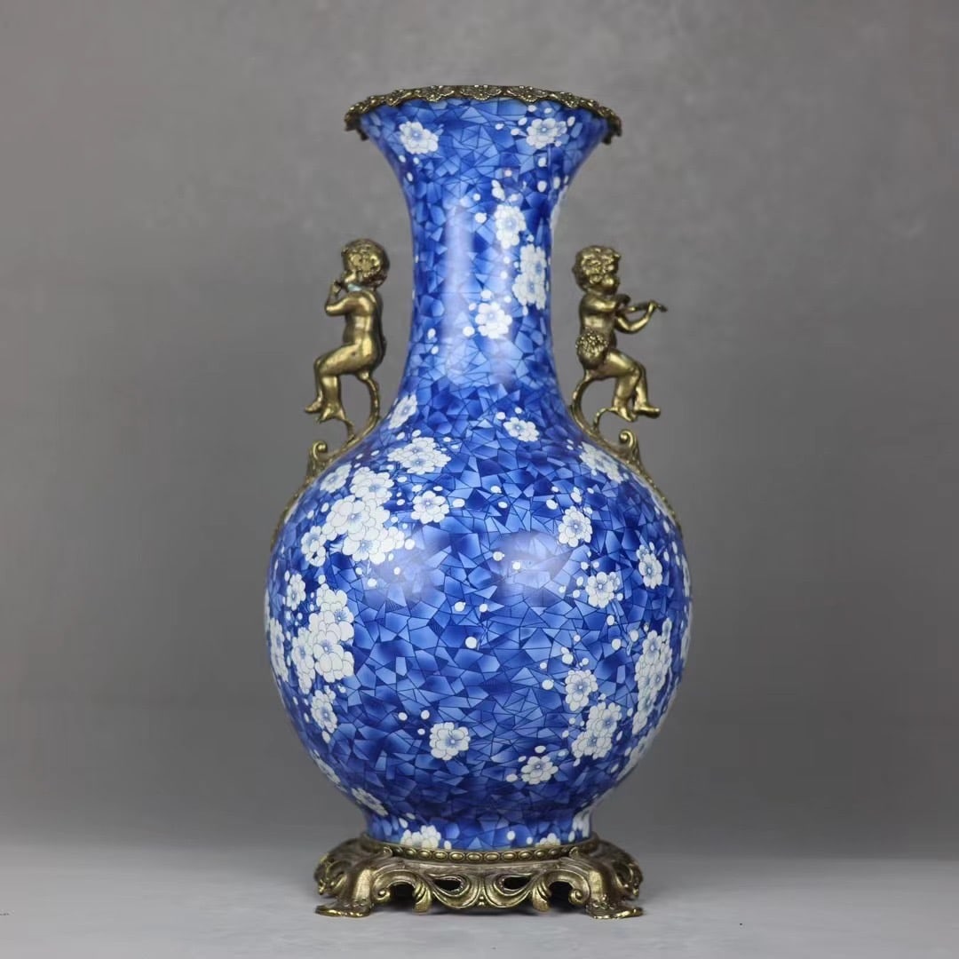 An Exquisite Blue and White Inlaid Bronze Flower Pattern Double-Ears Vase: An Exquisite Blue and White Inlaid Bronze Flower Pattern Double-Ears Vase Qing Dynasty, China Qianlong Six-character Mark Size:48.5cmx24cm (The Dimensions Of All Batches Are Manually Measured.If