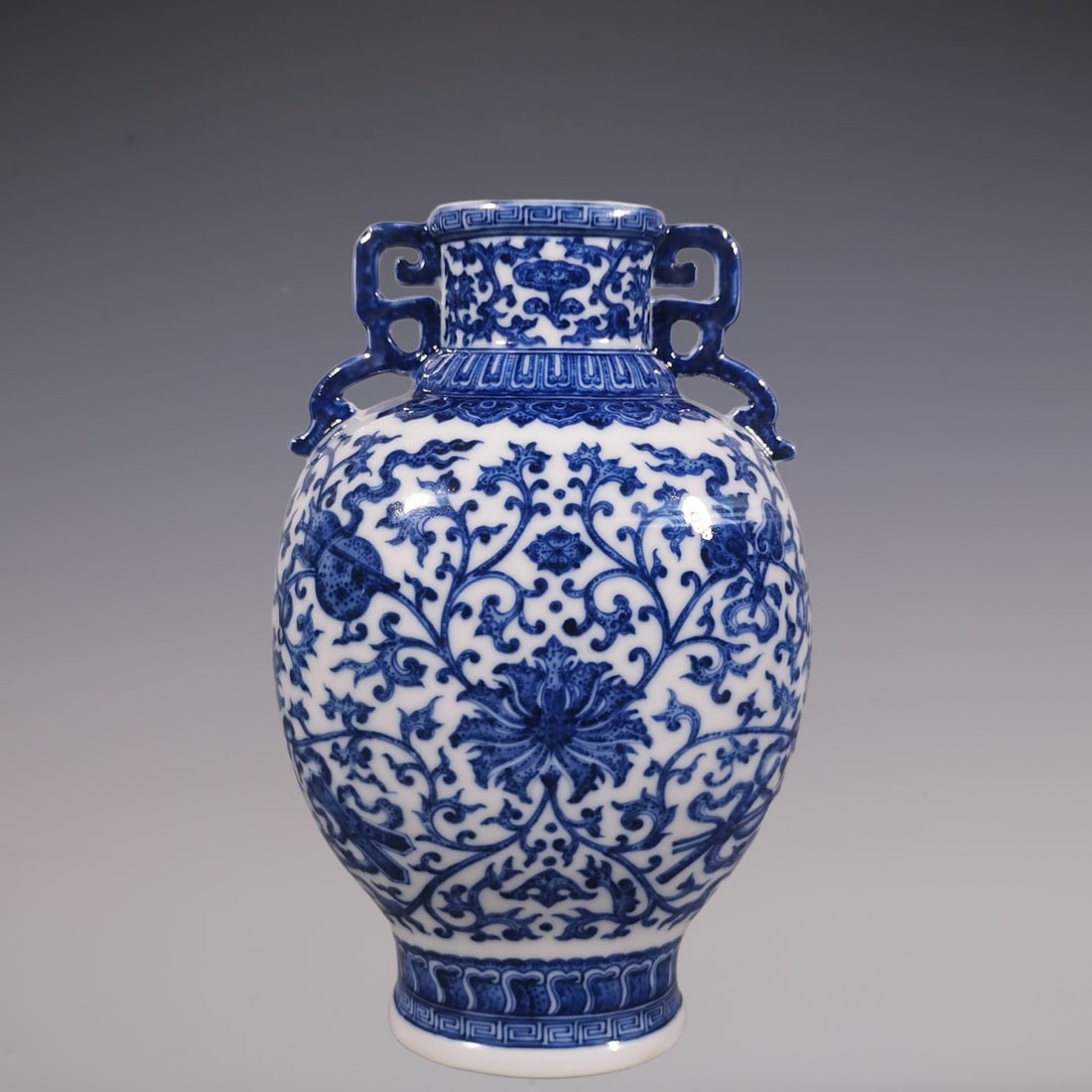 An Exquisite Blue and White Lotus Pattern Eight Treasures Pattern Double-Ears Vase: An Exquisite Blue and White Lotus Pattern Eight Treasures Pattern Double-Ears Vase Qing Dynasty, China Qianlong Six-character Mark Size:23.3cmx14.5cm (The Dimensions Of All Batches Are Manually