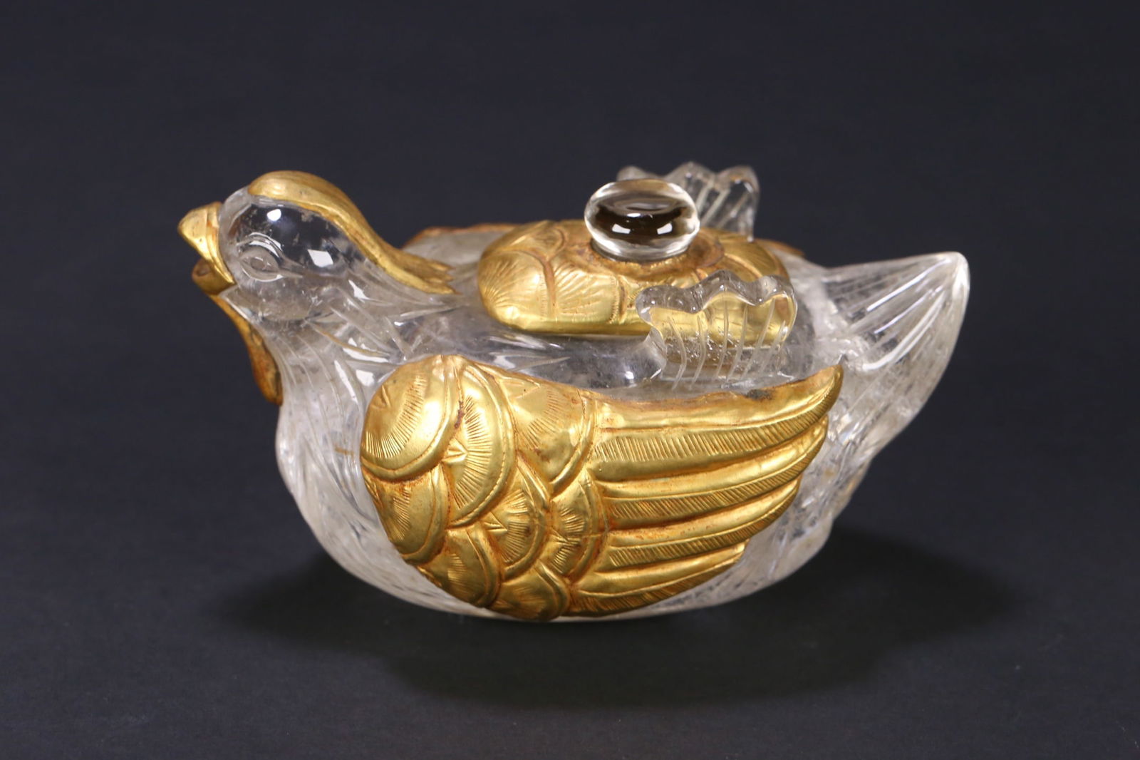 An Exquisite Crystal Inlaid Gilt Bronze Mandarin Duck-Shaped Teapot: An Exquisite Crystal Inlaid Gilt Bronze Mandarin Duck-Shaped Teapot Liao Dynasty, China Size:11cmx6.5cmx6.2cm Weight:355.6g (The Dimensions Of All Batches Are Manually Measured.If You Need More