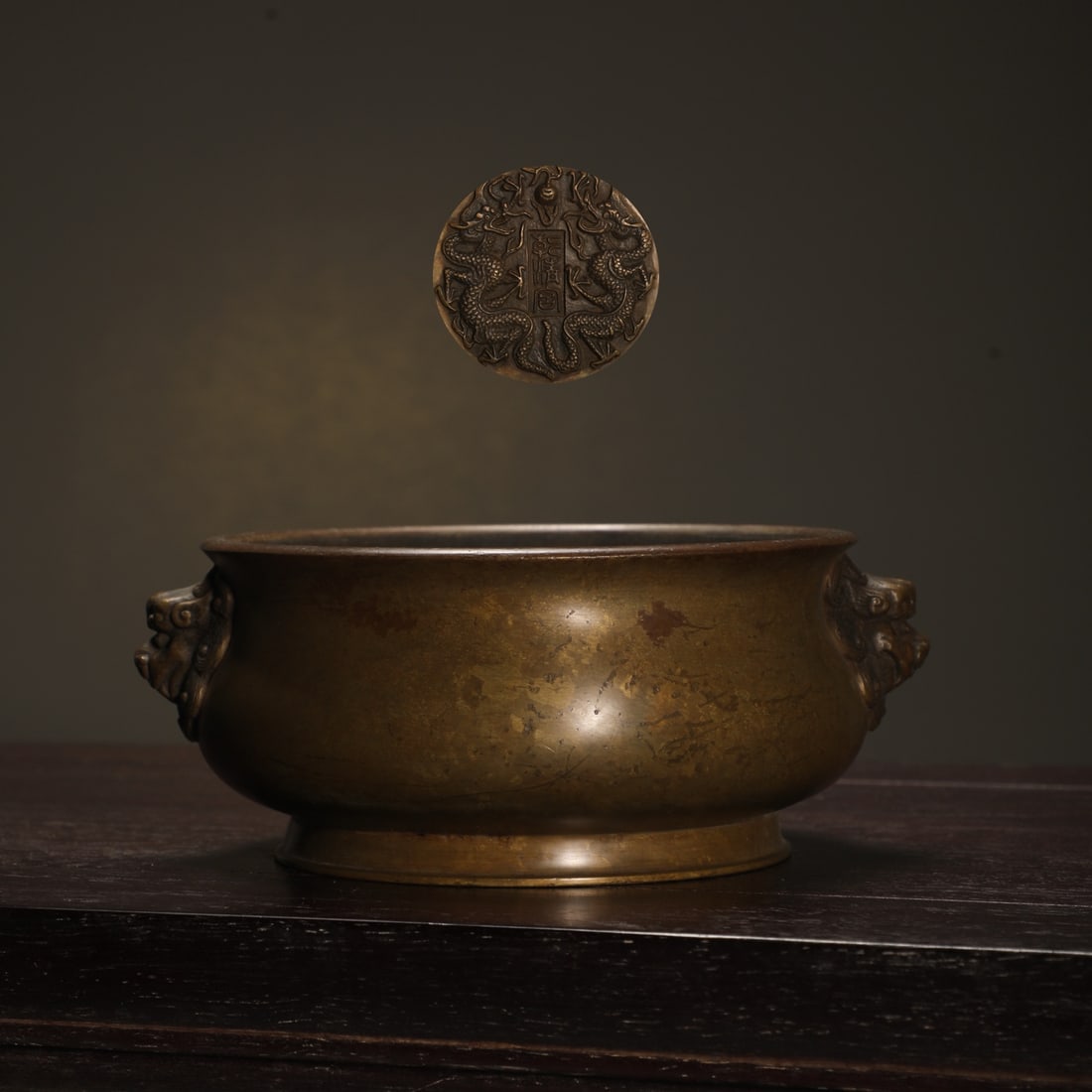 An Exquisite Bronze Dragon Pattern Double-Ears Censer: An Exquisite Bronze Dragon Pattern Double-Ears Censer Ming Dynasty, China Size:6.8cmx14.7cm Weight:1200g (The Dimensions Of All Batches Are Manually Measured.If You Need More Detailed Information,