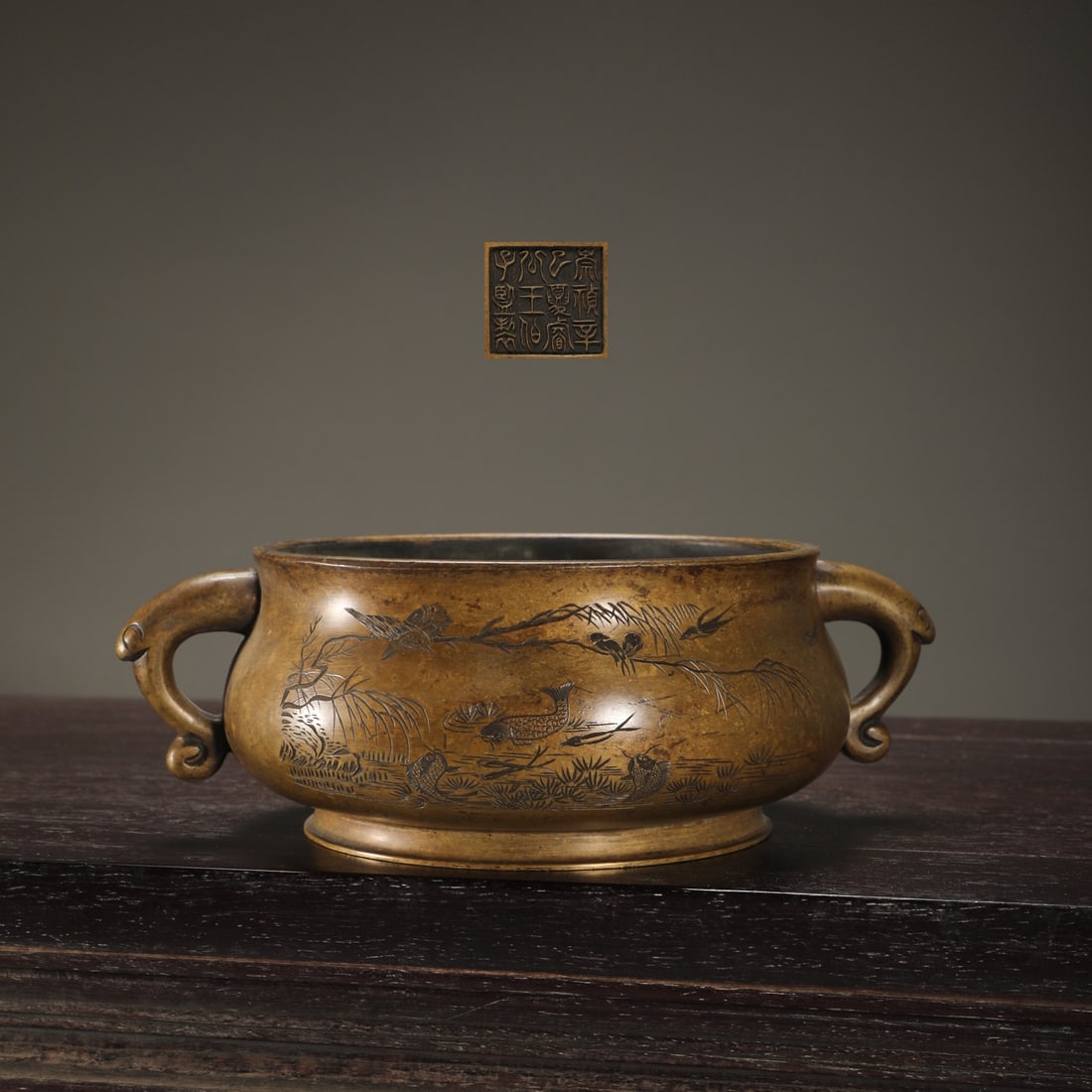 An Exquisite Bronze Fish and Lotus Pattern Double-Ears Censer: An Exquisite Bronze Fish and Lotus Pattern Double-Ears Censer Ming Dynasty, China Size:7.3cmx16cm Weight:1600g (The Dimensions Of All Batches Are Manually Measured.If You Need More Detailed