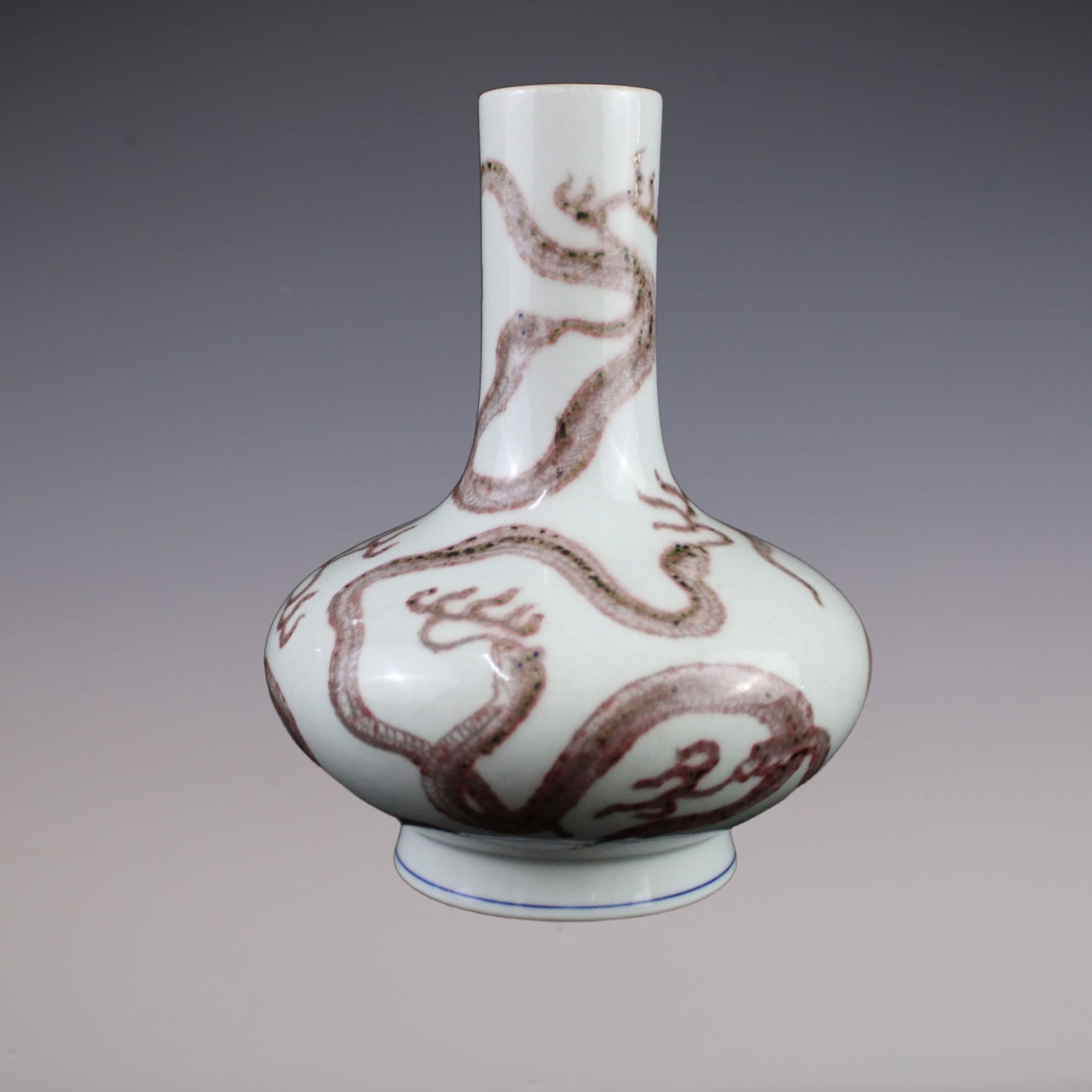 An Exquisite Underglaze-Red Dragon Pattern Vase: An Exquisite Underglaze-Red Dragon Pattern Vase Qing Dynasty, China Jiaqing Six-character Mark Size:22.cmx10.cm (The Dimensions Of All Batches Are Manually Measured.If You Need More Detailed