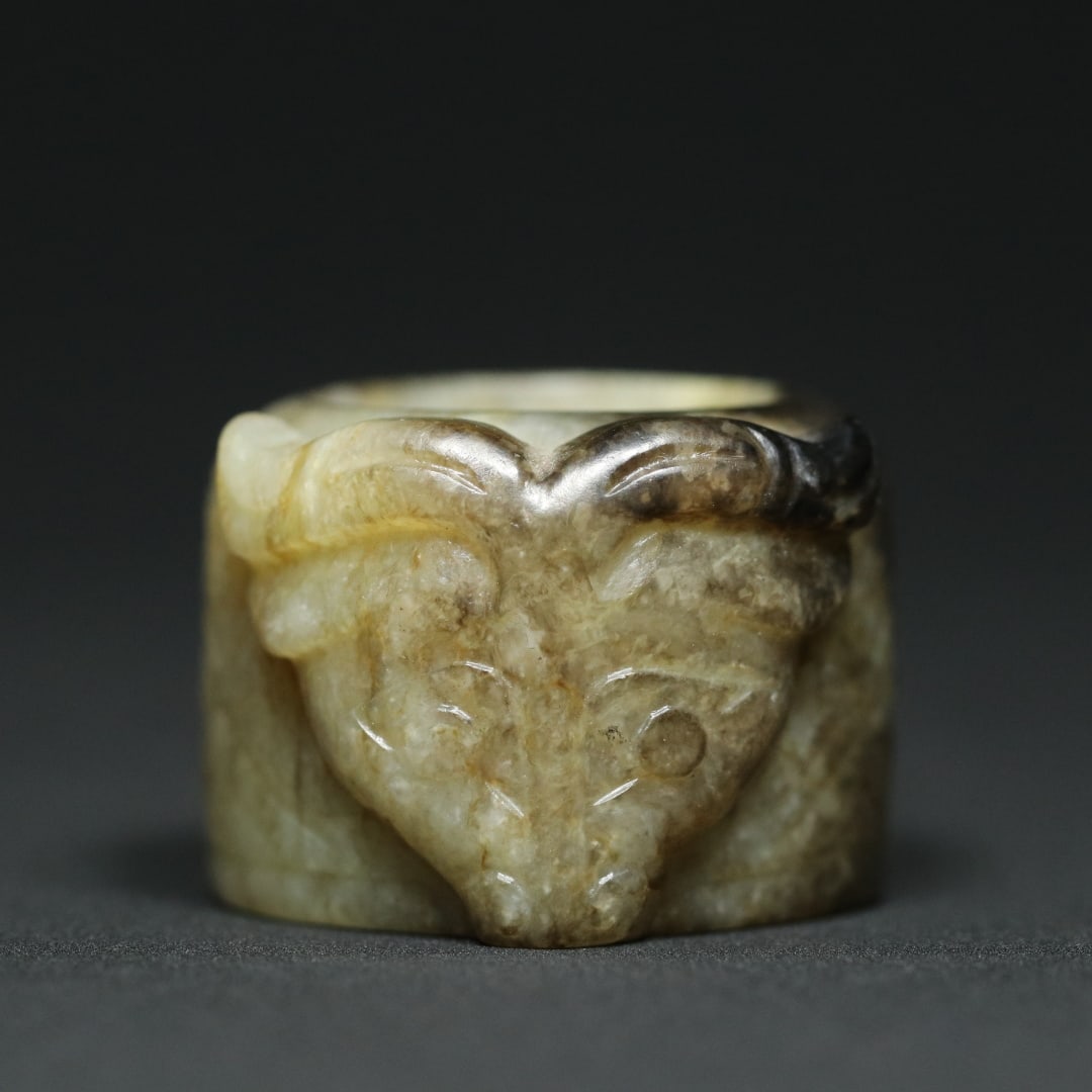 An Exquisite White Jade Beast-Face Pattern With Inscription Ring: An Exquisite White Jade Beast-Face Pattern With Inscription Ring Han Dynasty, China Size:4cmx3.5cmx2.5cm Size:(inside diameter)2.3cm Weight:42.8g (The Dimensions Of All Batches Are Manually Measured.I