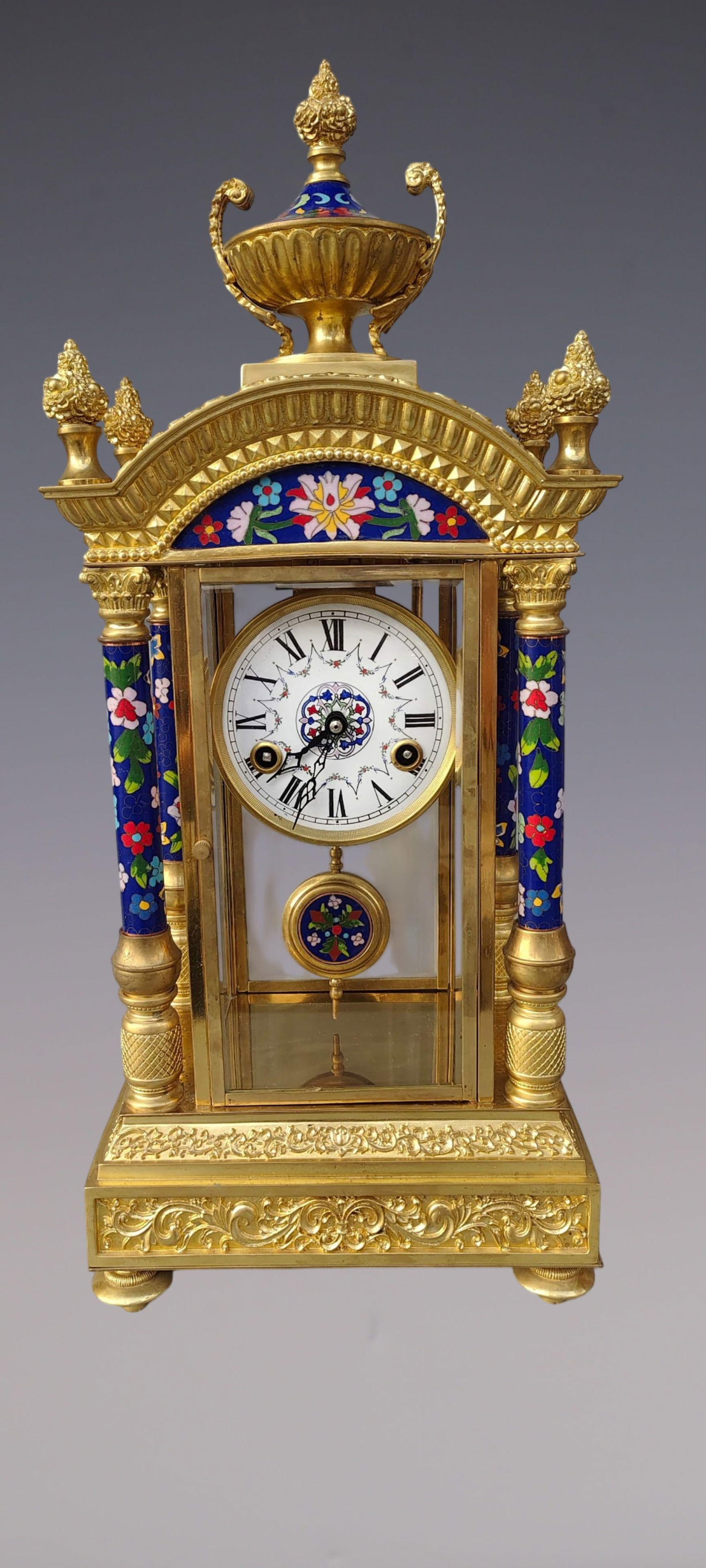 An Exquisite Gilt Bronze Lotus Pattern Clock: An Exquisite Gilt Bronze Lotus Pattern Clock Qing Dynasty, China Size:56cmx25cmx17cm (The Dimensions Of All Batches Are Manually Measured.If You Need More Detailed Information, Please Contact Our Cust