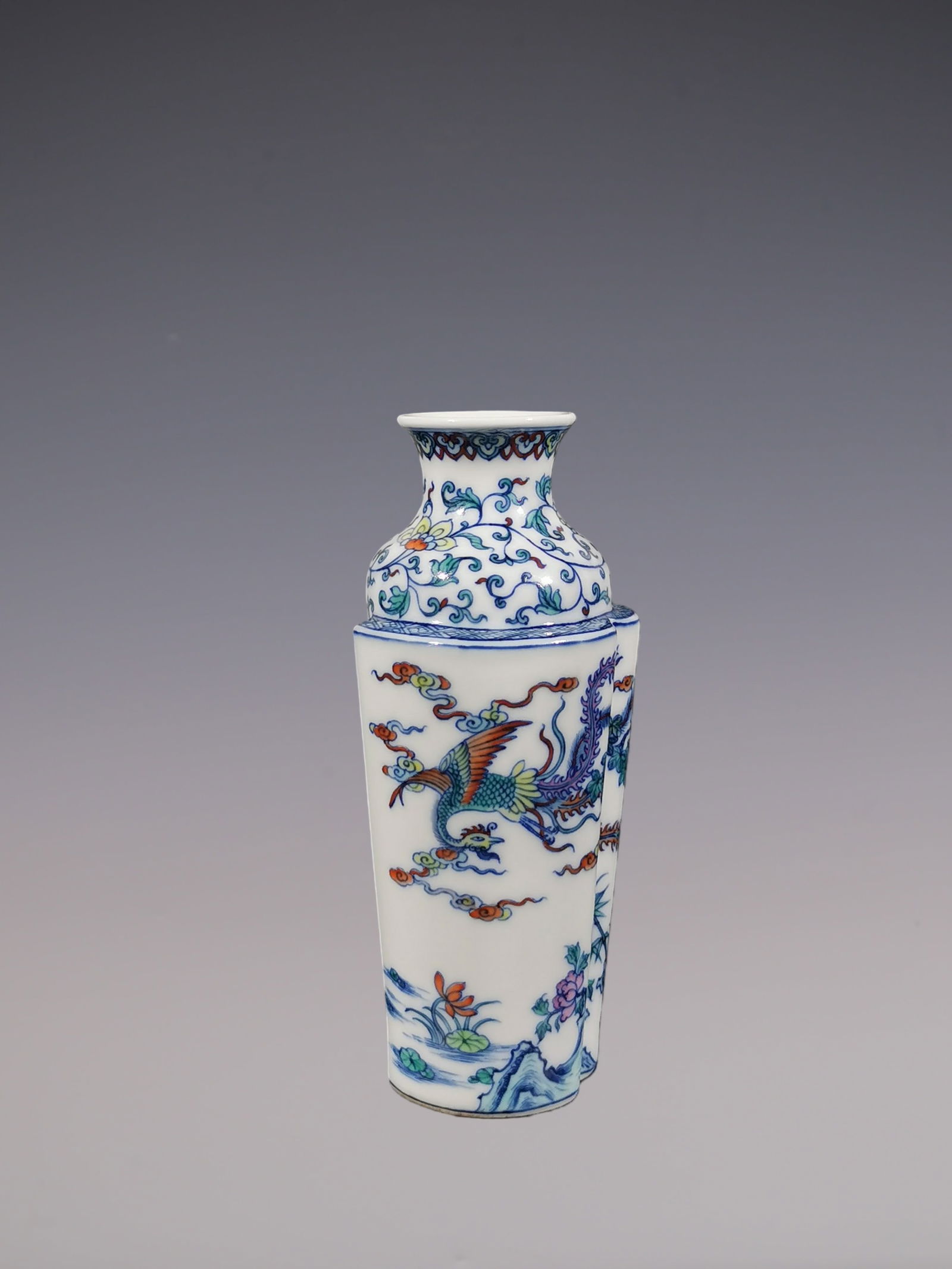 An Exquisite Doucai Blue and White Phoenix Pattern Lotus Pattern Vase: An Exquisite Doucai Blue and White Phoenix Pattern Lotus Pattern Vase Qing Dynasty, China Yongzheng Six-character Mark Size:16cmx7.3cm (The Dimensions Of All Batches Are Manually Measured.If You