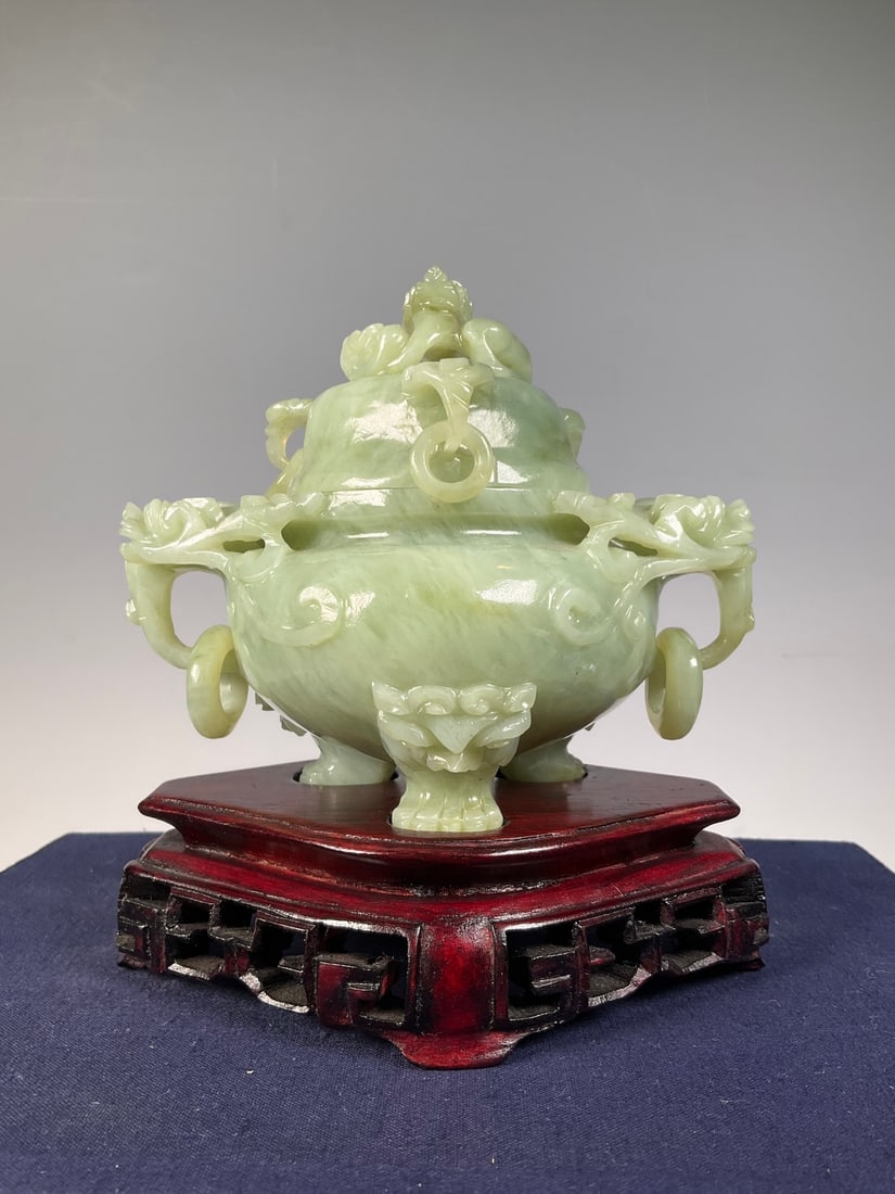 An Exquisite Serpentine Jade Beast-Face Pattern Double-Ears and Tripod Censer: An Exquisite Serpentine Jade Beast-Face Pattern Double-Ears and Tripod Censer Modern Time of China Size:15cmx14cm Weight:795g (The Dimensions Of All Batches Are Manually Measured.If You Need More