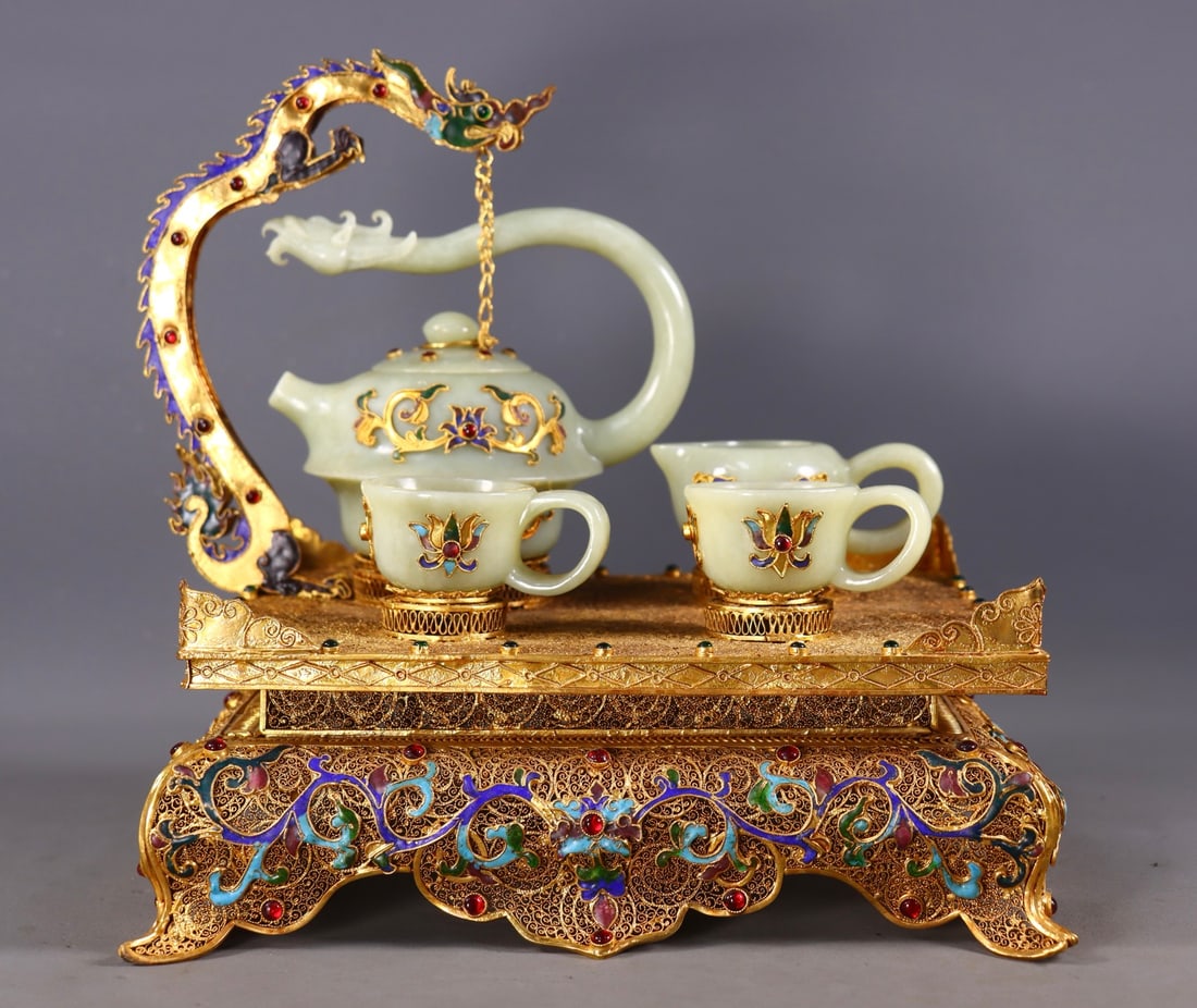 A Set of Fine Gilt Bronze Inlaid White Jade Lotus Pattern Teapot: A Set of Fine Gilt Bronze Inlaid White Jade Lotus Pattern Teapot Qing Dynasty, China Qianlong Four-character Mark Size:24cmx24cmx20.5cm Size:11cmx12.5cmx8cm Size:3cmx6cmx4.5cm Size:4cmx8cmx5.5cm