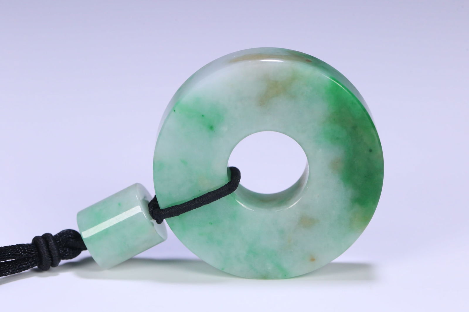 An Exquisite Jadeite Pendant: An Exquisite Jadeite Pendant Qing Dynasty, China Size:5.3cmx1.3cm Weight:91g (The Dimensions Of All Batches Are Manually Measured.If You Need More Detailed Information, Please Contact Our Customer