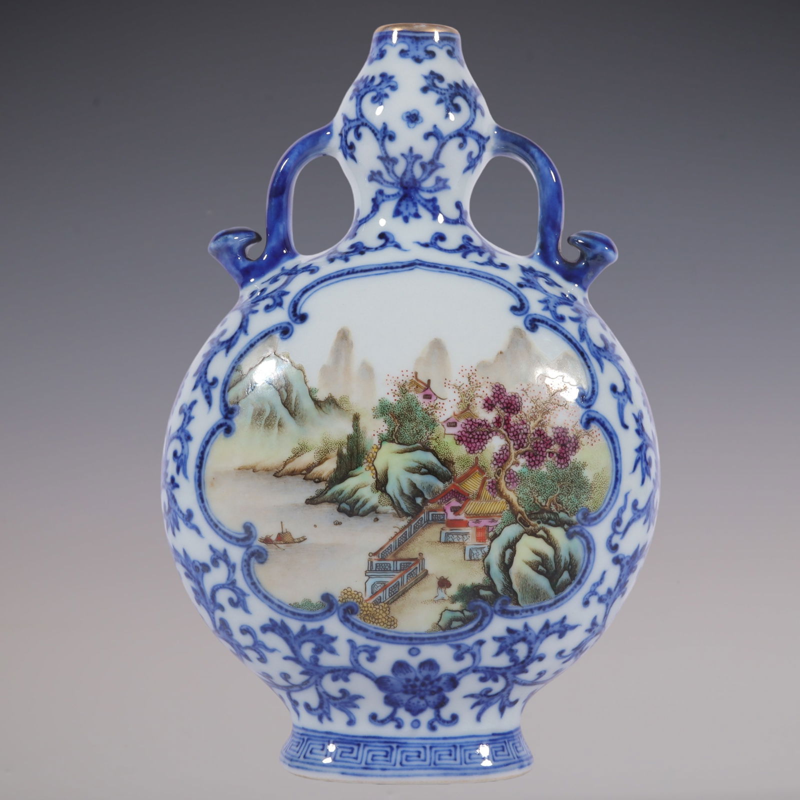 An Exquisite Famille-Rose Blue and White Lotus Pattern Landscape Pattern Double-Ears Vase: An Exquisite Famille-Rose Blue and White Lotus Pattern Landscape Pattern Double-Ears Vase Qing Dynasty, China Qianlong Six-character Mark Size:19.5cmx13cm (The Dimensions Of All Batches Are