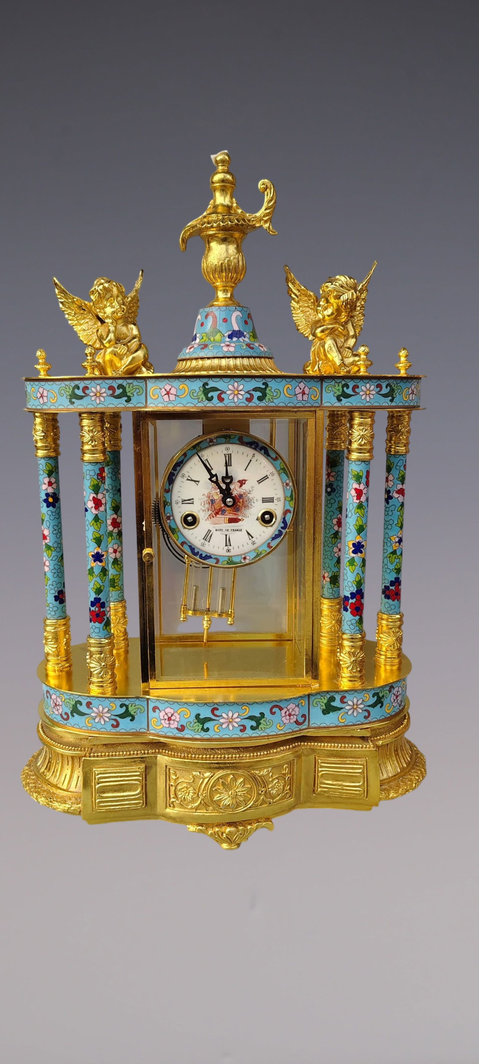 An Exquisite Gilt Bronze Lotus Pattern Clock: An Exquisite Gilt Bronze Lotus Pattern Clock Qing Dynasty, China Size:36cmx17cmx60cm (The Dimensions Of All Batches Are Manually Measured.If You Need More Detailed Information, Please Contact Our