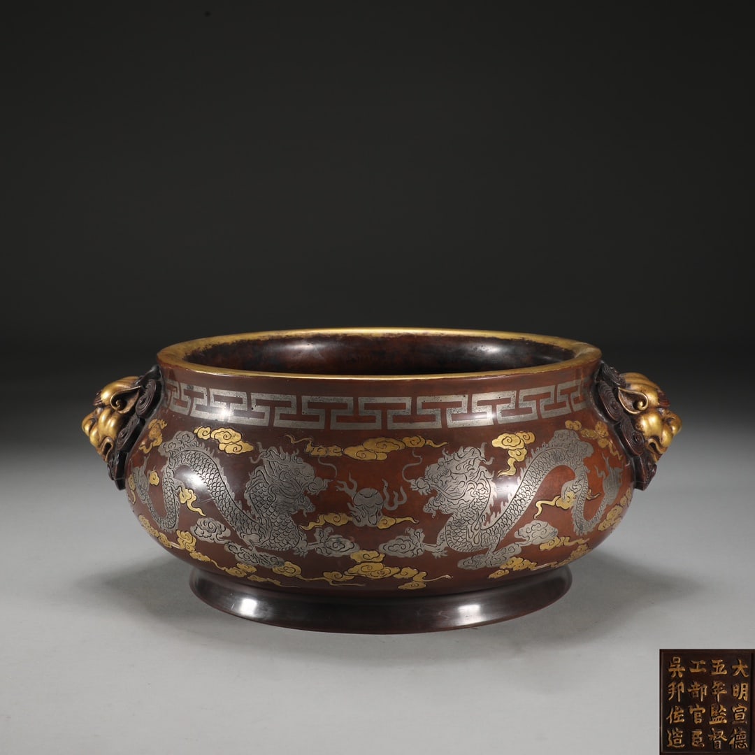 An Exquisite Bronze Inlaid Gold and Silver Dragon Pattern Double-Ears Censer: An Exquisite Bronze Inlaid Gold and Silver Dragon Pattern Double-Ears Censer Ming Dynasty, China Size:13cmx27.2cm Weight:10.4kg (The Dimensions Of All Batches Are Manually Measured.If You Need More