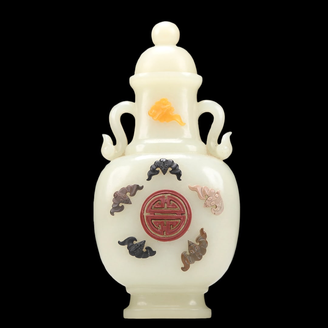 A Superb White Jade Gem-Inlaid 'Bat& Auspicious Cloud' Vase: A Superb White Jade Gem-Inlaid 'Bat& Auspicious Cloud' Vase. Supported on a subtly splayed foot, body inlaid in polychrome with bats in flight and a medallion, topknot surmounted by a knop. Chinese Qi
