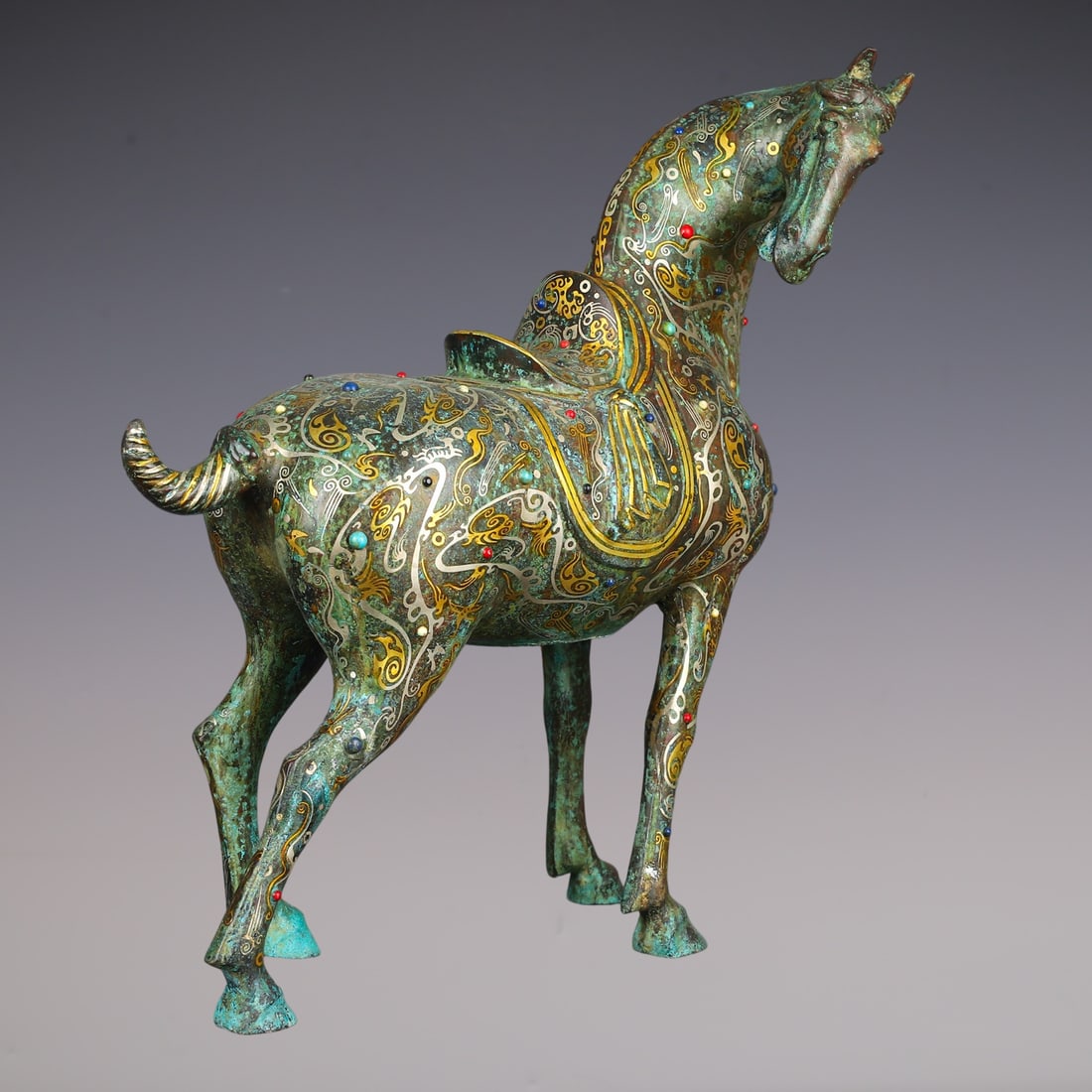 An Exquisite Bronze Inlaid Gold Inlaid Gems Horse Ornament: An Exquisite Bronze Inlaid Gold Inlaid Gems Horse Ornament Han Dynasty, China Size:44cmx18cmx47cm Weight:6280g (The Dimensions Of All Batches Are Manually Measured.If You Need More Detailed