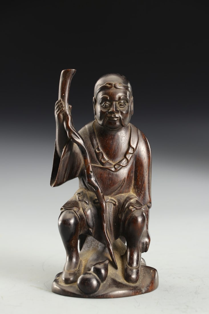 An Exquisite Zitanwood Figure Ornament: An Exquisite Zitanwood Figure Ornament Qing Dynasty, China Size:6x5x12cm Weight:118g (The Dimensions Of All Batches Are Manually Measured.If You Need More Detailed Information, Please Contact Our
