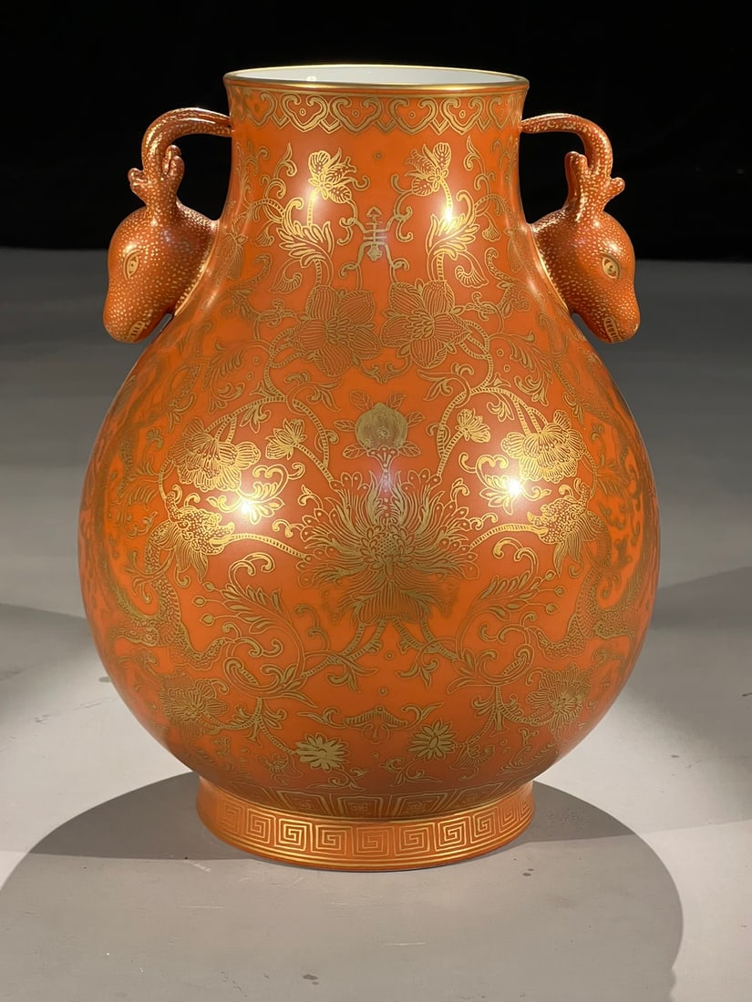 An Exquisite Coral Red Glazed Painted Gold Lotus Pattern Double-Ears Vase: An Exquisite Coral Red Glazed Painted Gold Lotus Pattern Double-Ears Vase Qing Dynasty, China Yongzheng Six-character Mark Size:26.5cm (The Dimensions Of All Batches Are Manually Measured.If You