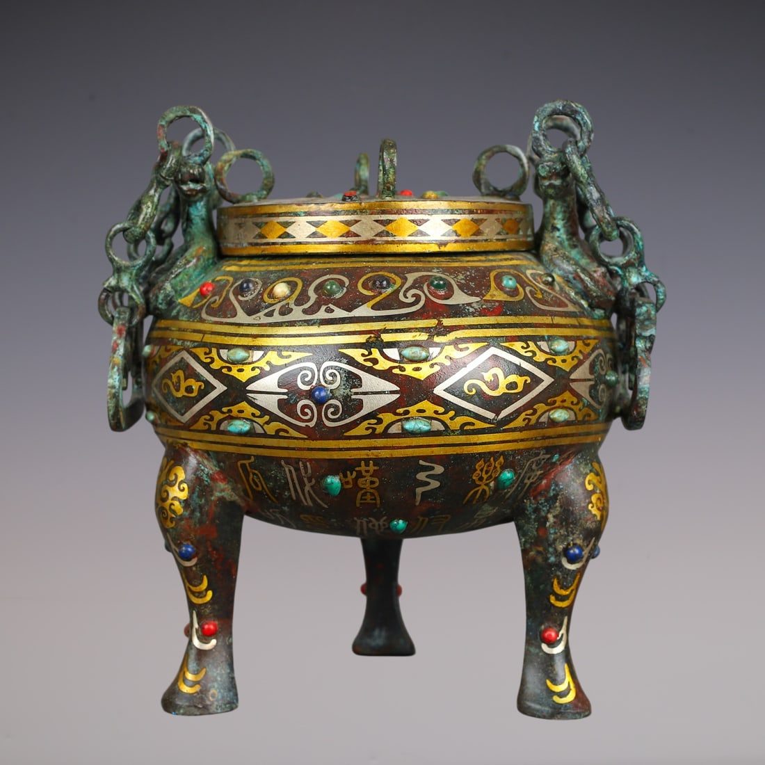 An Exquisite Bronze Inlaid Gold Inlaid Gems With Inscription Double-Ears and Tripod Censer: An Exquisite Bronze Inlaid Gold Inlaid Gems With Inscription Double-Ears and Tripod Censer Han Dynasty, China Size:18cmx19cm Weight:2030g (The Dimensions Of All Batches Are Manually Measured.If You