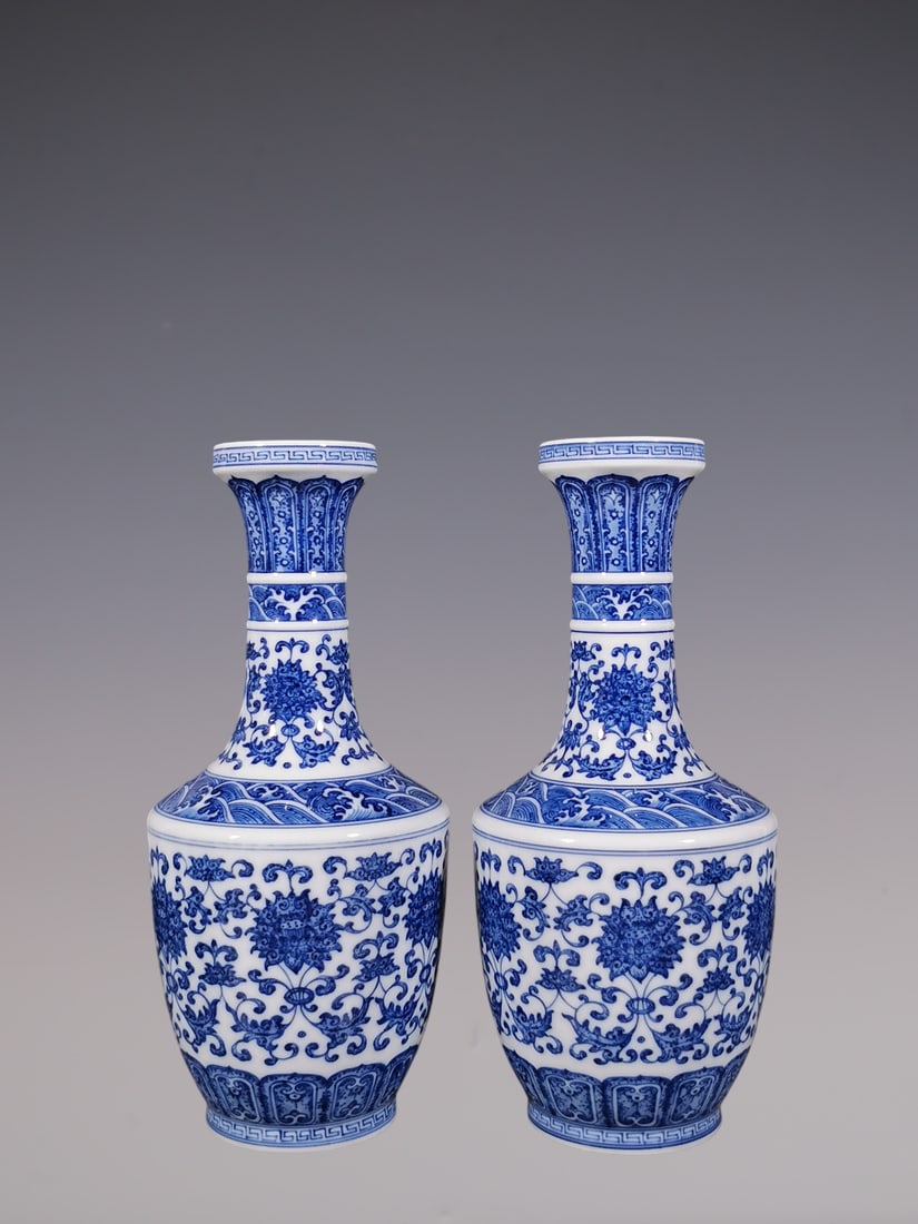An Exquisite Blue and White Lotus Pattern Seawater Pattern Vase: An Exquisite Blue and White Lotus Pattern Seawater Pattern Vase Qing Dynasty, China Qianlong Six-character Mark Size:23.2cmx10.3cm (The Dimensions Of All Batches Are Manually Measured.If You Need