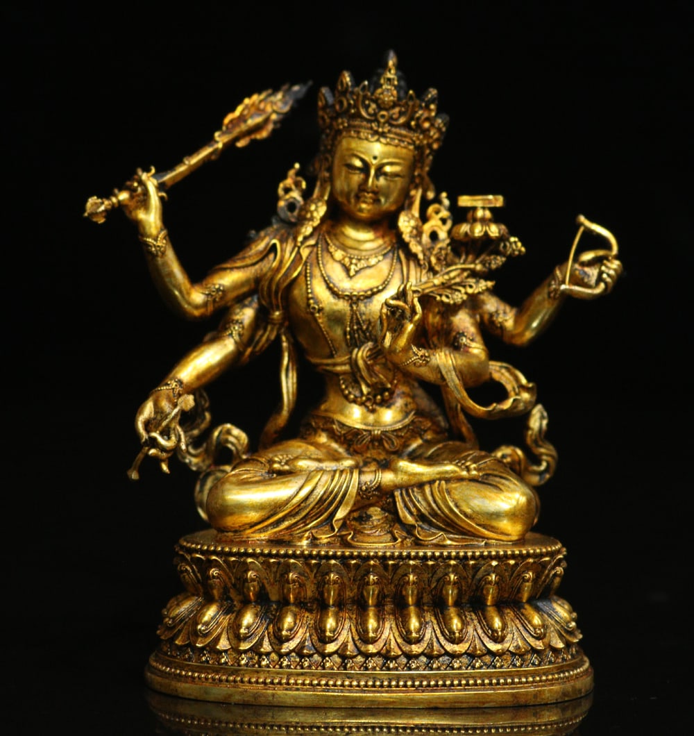 An Exquisite Gilt Bronze Four-arms Statue of Manjusri Ornament: An Exquisite Gilt Bronze Four-arms Statue of Manjusri Ornament Ming Dynasty, China Size:10cmx9.5cm Weight:484g (The Dimensions Of All Batches Are Manually Measured.If You Need More Detailed