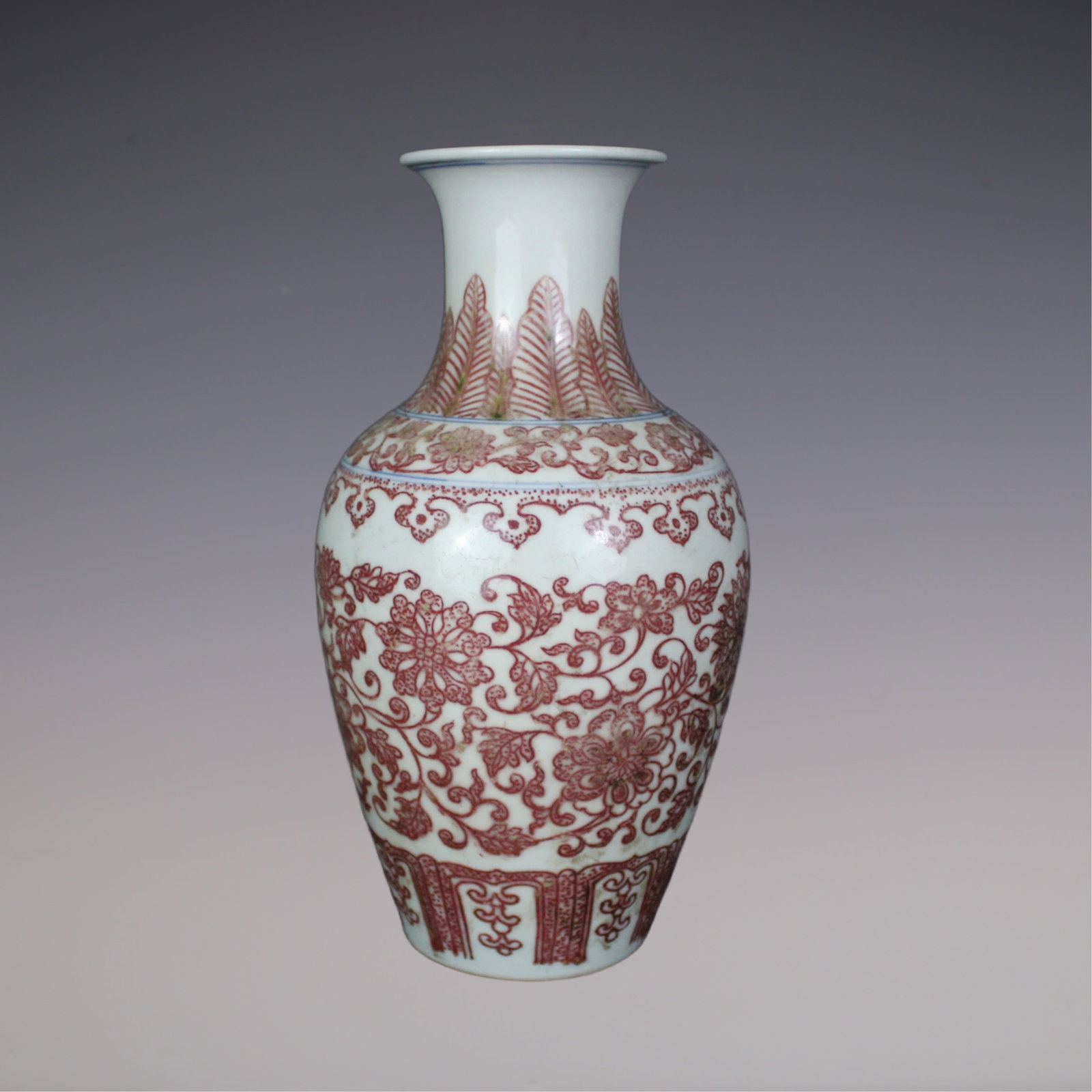An Exquisite Underglaze-Red Lotus Pattern Vase: An Exquisite Underglaze-Red Lotus Pattern Vase Qing Dynasty, China Qianlong Six-character Mark Size:23cmx7.5cm (The Dimensions Of All Batches Are Manually Measured.If You Need More Detailed