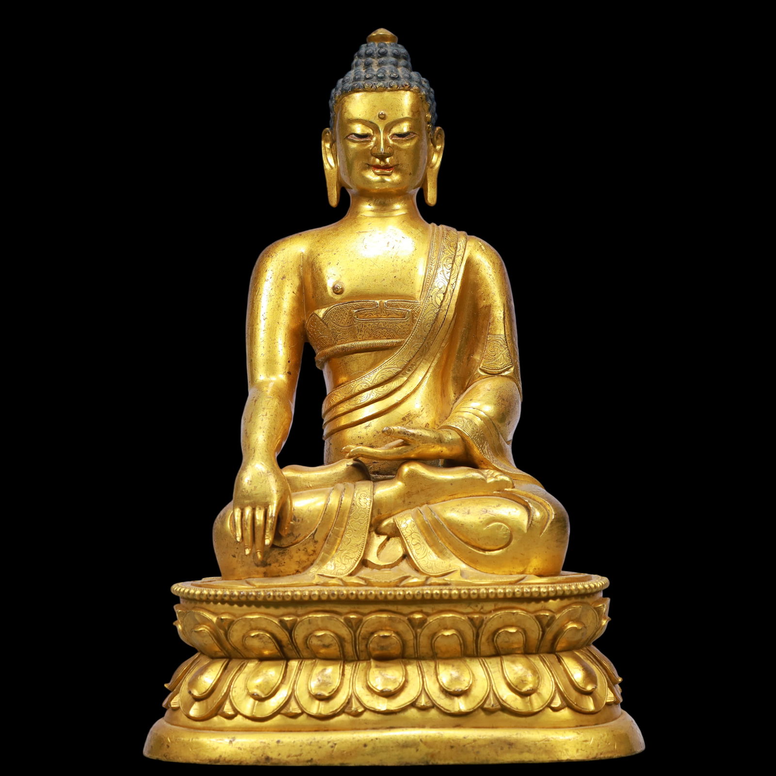 An Exquisite Gilt Bronze Statue of Sakyamuni: An Exquisite Gilt Bronze Statue of Sakyamuni Ming Dynasty, China Size:16cmx11cmx26cm Weight:3400g (The Dimensions Of All Batches Are Manually Measured.If You Need More Detailed Information, Please