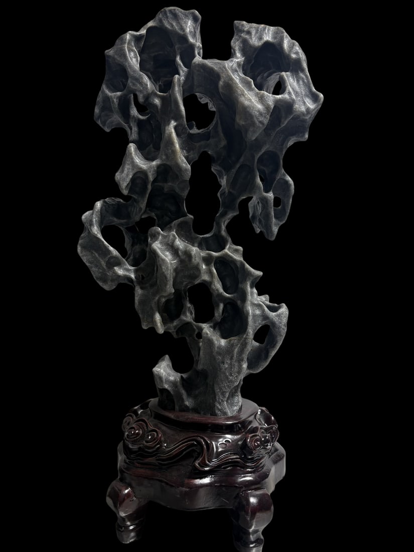 An Exquisite Taihu Stone Ornament: An Exquisite Taihu Stone Ornament Qing Dynasty, China Size:60cmx25cmx15cm Weight:12kg (The Dimensions Of All Batches Are Manually Measured.If You Need More Detailed Information, Please Contact Our