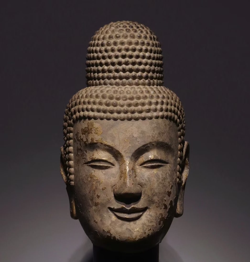 An Exquisite Limestone Buddha head: An Exquisite Limestone Buddha head Wei Dynasty, China Size:45cm (The Dimensions Of All Batches Are Manually Measured.If You Need More Detailed Information, Please Contact Our Customer Service Before B