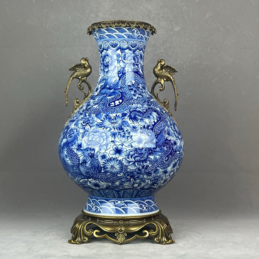 An Exquisite Blue and White Inlaid Bronze Dragon Pattern Flower Pattern Seawater Pattern Double-Ears: An Exquisite Blue and White Inlaid Bronze Dragon Pattern Flower Pattern Seawater Pattern Double-Ears Vase Qing Dynasty, China Qianlong Six-character Mark Size:48cmx27cm (The Dimensions Of All