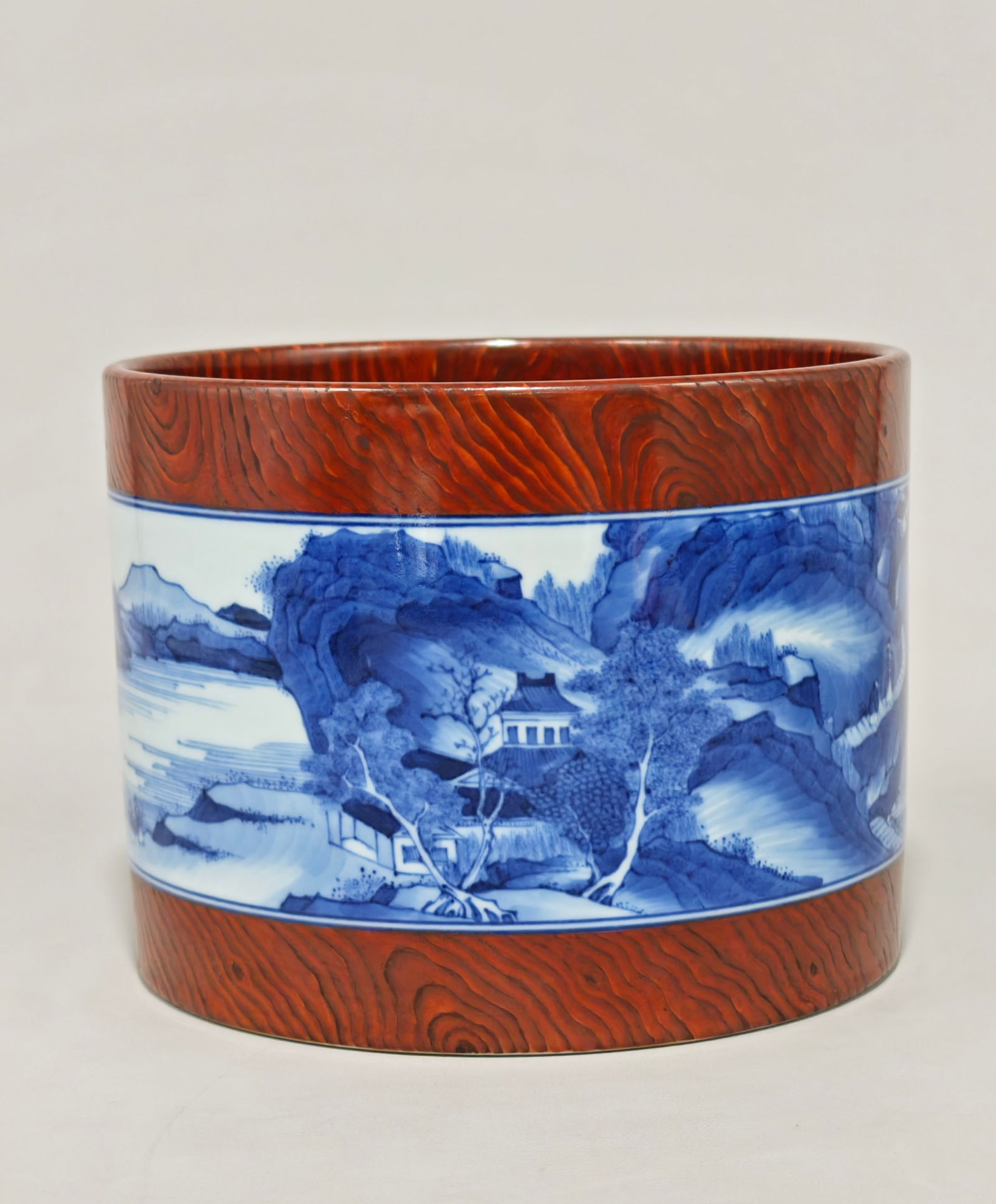 An Exquisite Blue and White Imitation Wood Grain Glazed Landscape Pattern Brush Pot: An Exquisite Blue and White Imitation Wood Grain Glazed Landscape Pattern Brush Pot Qing Dynasty, China Yongzheng Four-character Mark Size:14.3cmx18.8cm (The Dimensions Of All Batches Are Manually