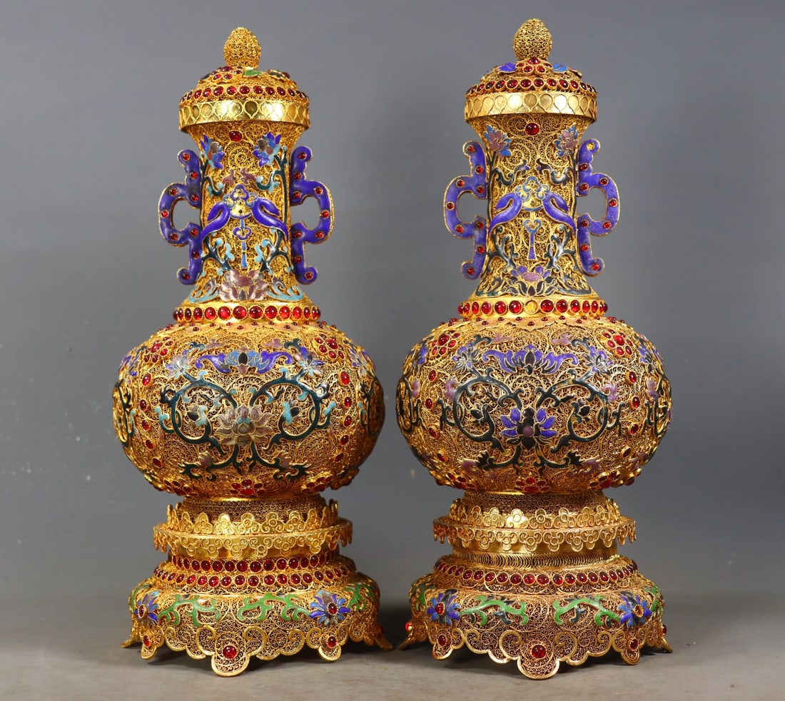 A Pair of Exquisite Gilt Bronze Inlaid Gems Lotus Pattern Double-Ears Vase: A Pair of Exquisite Gilt Bronze Inlaid Gems Lotus Pattern Double-Ears Vase Qing Dynasty, China Qianlong Four-character Mark Size:32.5cmx14cm Weight:2210g (The Dimensions Of All Batches Are Manually