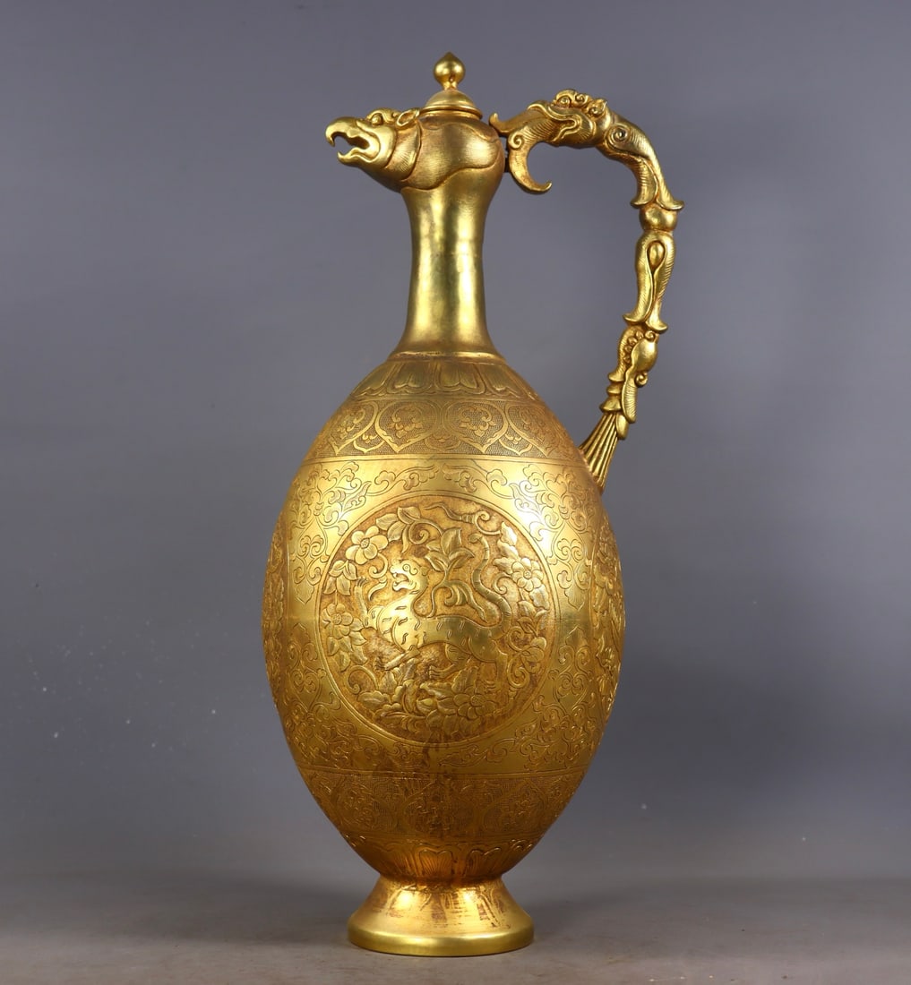 An Exquisite Gilt Bronze Lotus Pattern Auspicious Beast Pattern Ewer: An Exquisite Gilt Bronze Lotus Pattern Auspicious Beast Pattern Ewer Tang Dynasty, China Size:40cmx19cmx13.5cm Weight:2480g (The Dimensions Of All Batches Are Manually Measured.If You Need More