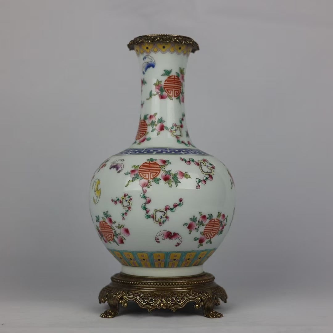 An Exquisite Famille-Rose Inlaid Bronze Bats and Peach Pattern Vase: An Exquisite Famille-Rose Inlaid Bronze Bats and Peach Pattern Vase Qing Dynasty, China Qianlong Six-character Mark Size:28cmx14cm (The Dimensions Of All Batches Are Manually Measured.If You Need