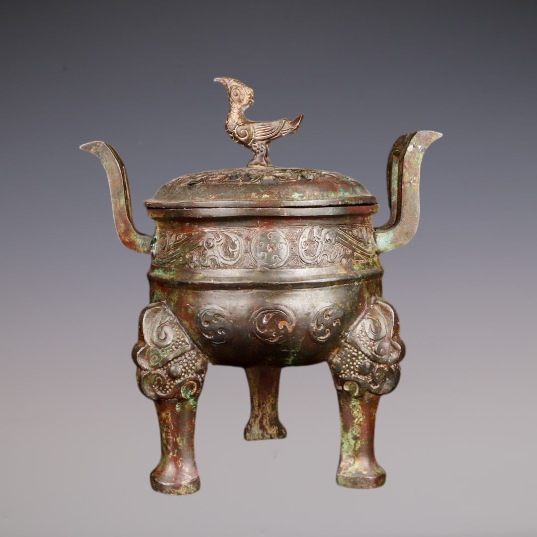 An Exquisite Bronze Beast-Face Pattern Double-Ears and Tripod Censer: An Exquisite Bronze Beast-Face Pattern Double-Ears and Tripod Censer Han Dynasty, China Size:25cmx18cmx29cm Weight:3340g (The Dimensions Of All Batches Are Manually Measured.If You Need More