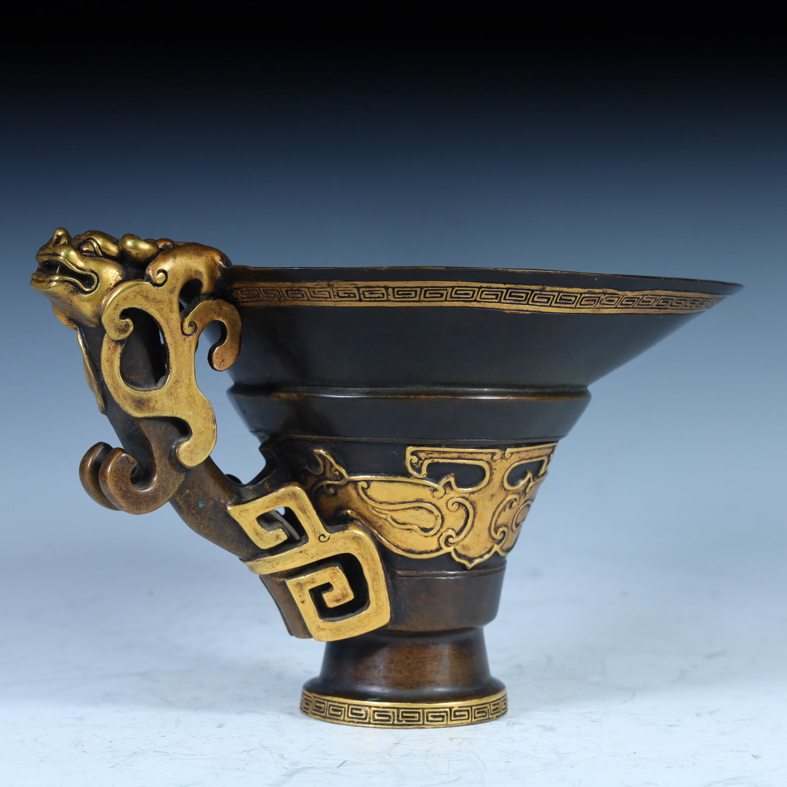 A Qing Dynasty copper partially gilt dragon cup: Qing Dynasty copper partially gilt dragon cup SIZE: W:11cm L:20cm W:15cm W:1318g (The Dimensions Of All Batches Are Manually Measured.If You Need More Detailed Information, Please Contact Our