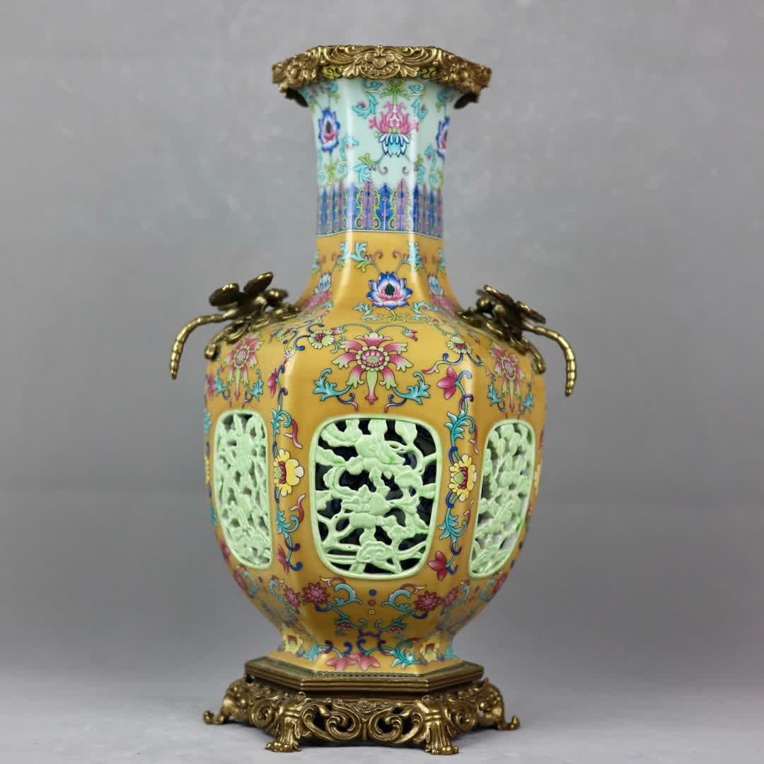 A Qing Dynasty copper-inlaid porcelain "yellow pastel hollowed" dragonfly ear hexagonal bottle: Qing Dynasty copper-inlaid porcelain "yellow pastel hollowed" dragonfly ear hexagonal bottle SIZE: H: 45cm mouthD: 15cm D: 27cm Bottom diameter 21cm (The Dimensions Of All Batches Are Manually Measure