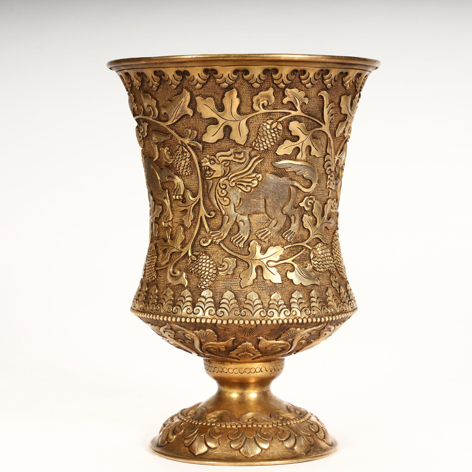 A copper-gilt auspicious beast grape-patterned goblet.: Copper gilt auspicious beast grape pattern goblet. SIZE: H:14cm L:10cm W:10cm W:503g (The Dimensions Of All Batches Are Manually Measured.If You Need More Detailed Information, Please Contact Our Cust