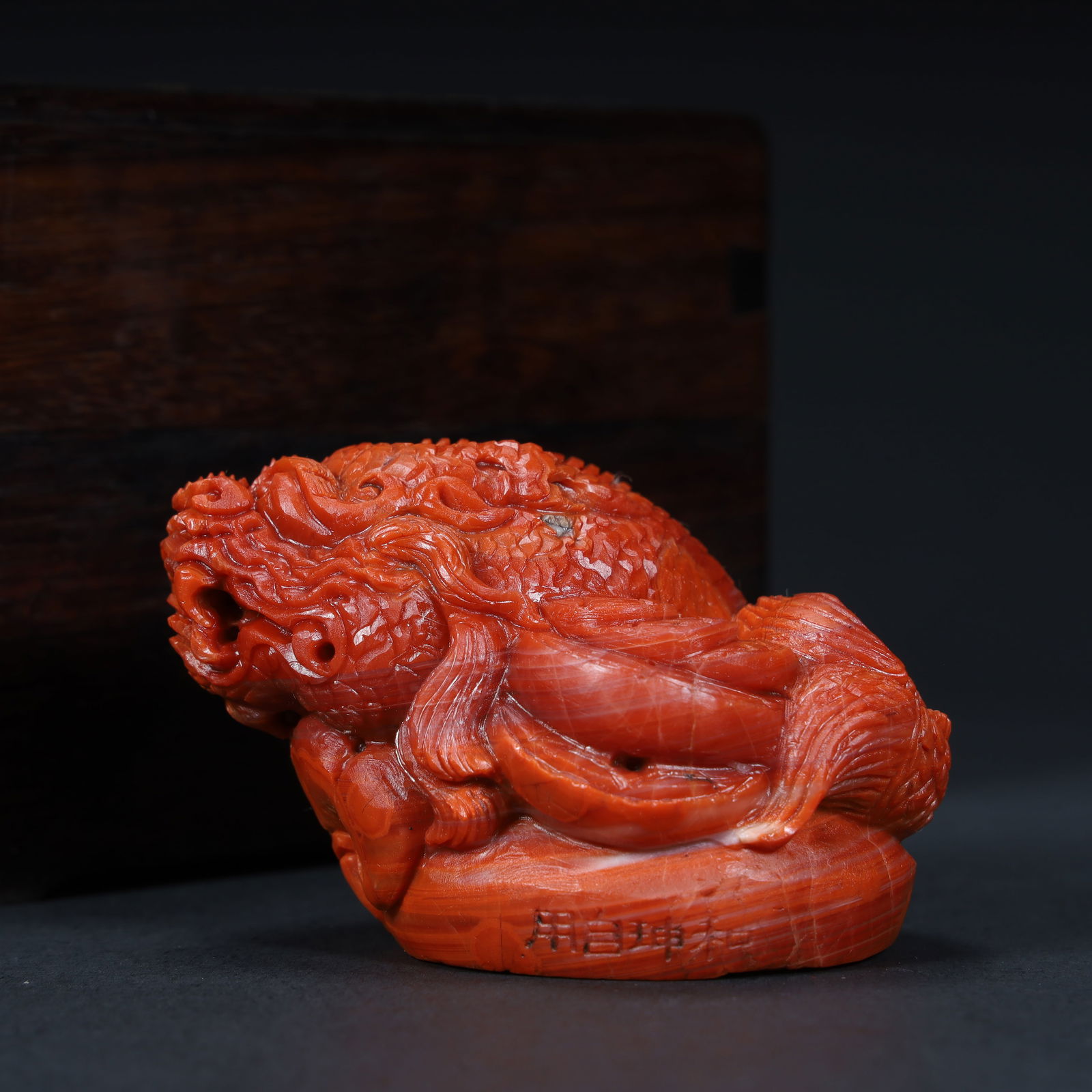 A Qing Dynasty "Heshen Old Collection" red coral dragon pattern ornament (with mahogany box).: Qing Dynasty "Heshen Old Collection" red coral dragon pattern ornament (with mahogany box). SIZE: 17?H:5cm L:7cm W:5.2cm W:198.8g (The Dimensions Of All Batches Are Manually Measured.If You Need More