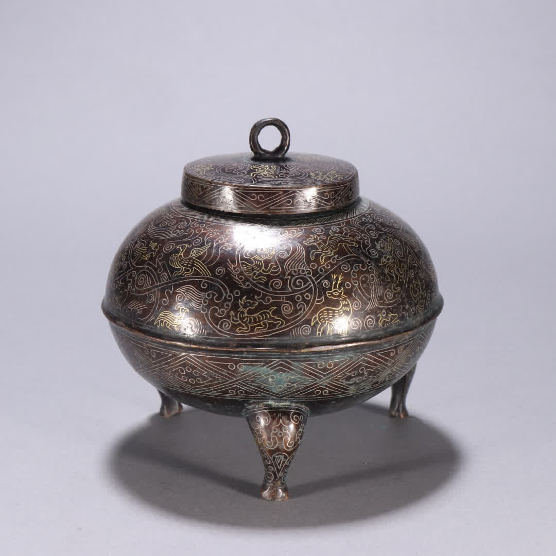A Han Dynasty copper gold and silver tripod: Han Dynasty copper and gold and silver three-legged tripod SIZE: H:10.7cm W:10.5cm W:545.1g (The Dimensions Of All Batches Are Manually Measured.If You Need More Detailed Information, Please Contact O