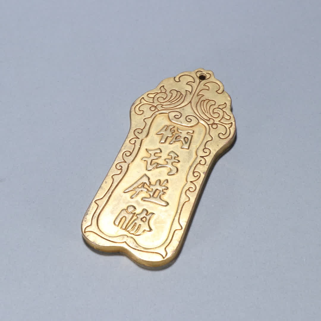 A copper-gilt token of the Liao Dynasty: Liao Dynasty copper gilt token SIZE: L:12cm W:5.7cm W:250g (The Dimensions Of All Batches Are Manually Measured.If You Need More Detailed Information, Please Contact Our Customer Service Before Biddin