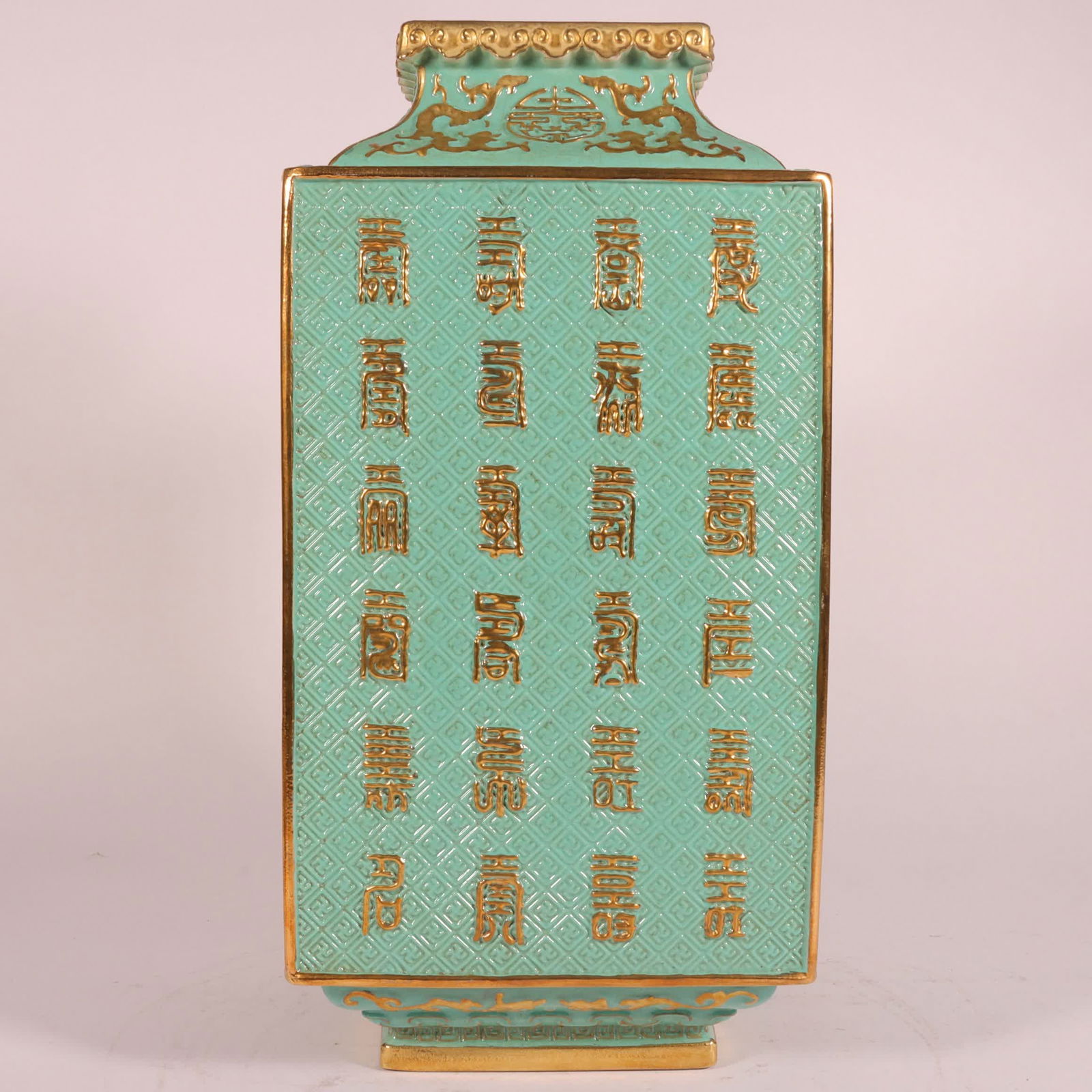 A Qing Qianlong green space carved gold-painted longevity pattern square bottle: Qing Qianlong green space carved gold-painted longevity pattern square bottle SIZE: H: 31cm Belly diameter 15cm (The Dimensions Of All Batches Are Manually Measured.If You Need More Detailed Informati
