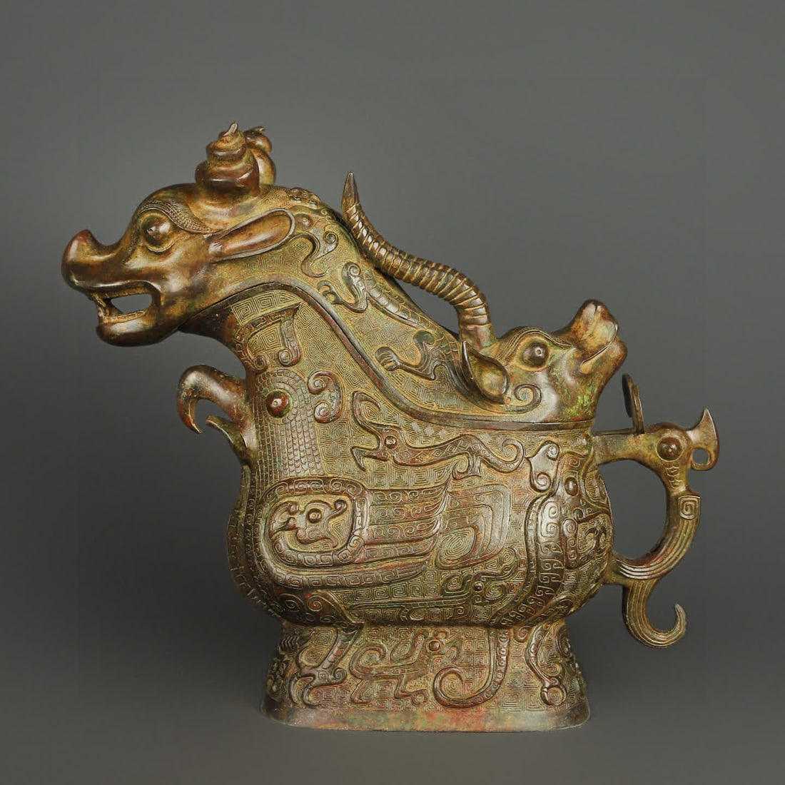 A Western Zhou bronze beast cup: Western Zhou bronze beast cup SIZE: W:9150g L:45cm H:41cm (The Dimensions Of All Batches Are Manually Measured.If You Need More Detailed Information, Please Contact Our Customer Service Before Bidding