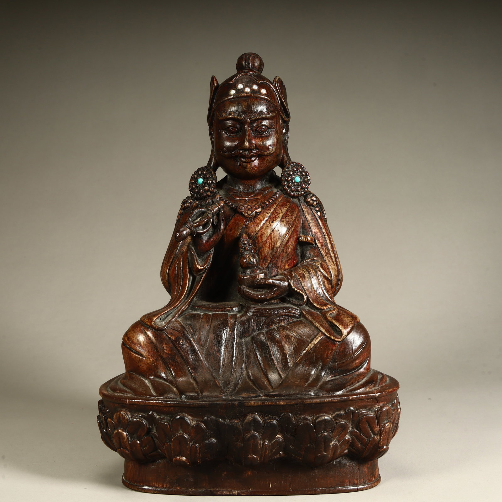 A Qing Dynasty agarwood carved lotus peanut master statue size quantity: Qing Dynasty agarwood carving lotus peanut master statue size and quantity SIZE: H:25cm L:17cm W:11.5cm W:572g (The Dimensions Of All Batches Are Manually Measured.If You Need More Detailed Informatio