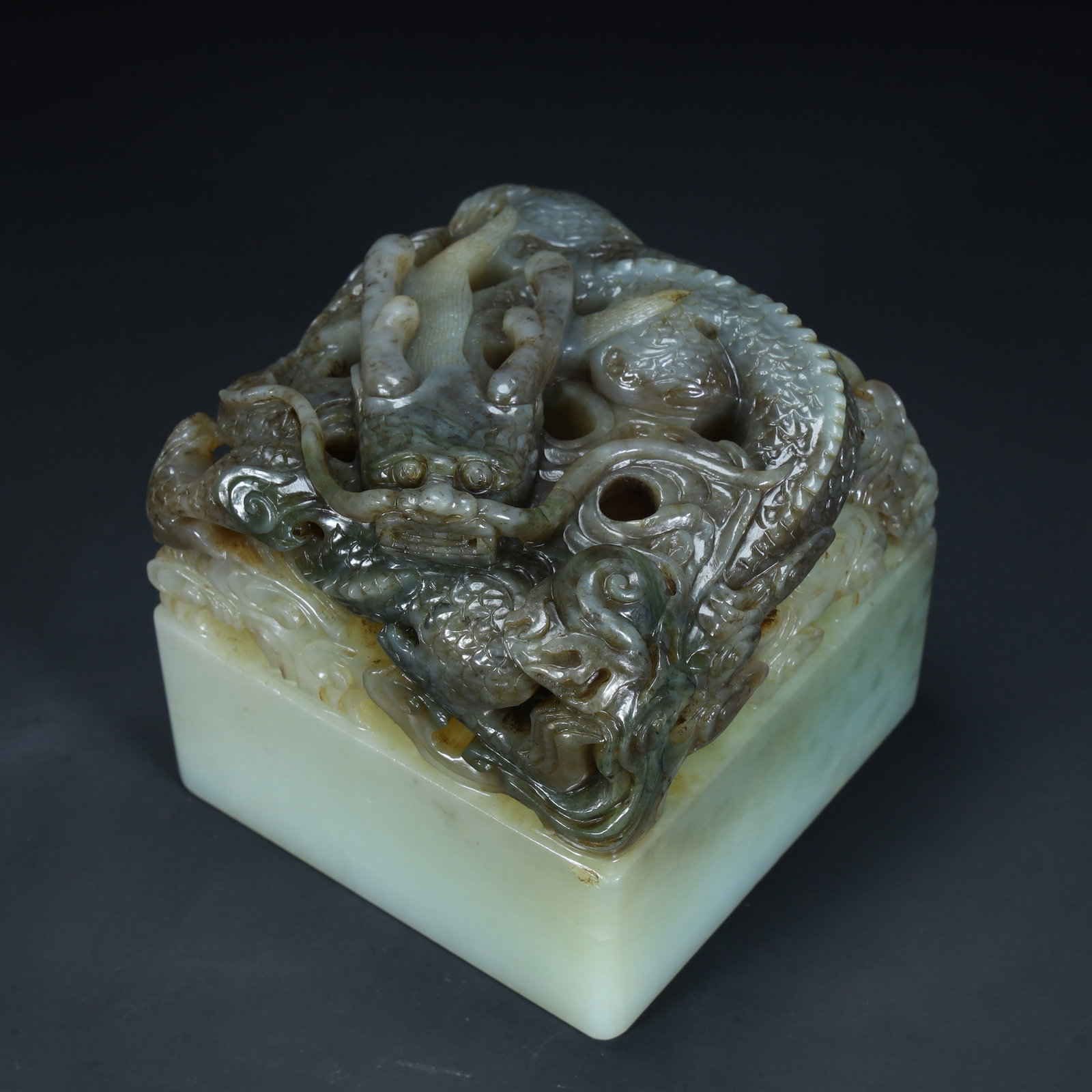 A Qing Dynasty Hetian jade blue and white material plate dragon button square seal: Qing Dynasty Hetian jade blue and white material plate dragon button square seal SIZE: H:8.8cm L:8.8cm W:8.8cm W:1362g (The Dimensions Of All Batches Are Manually Measured.If You Need More Detailed In