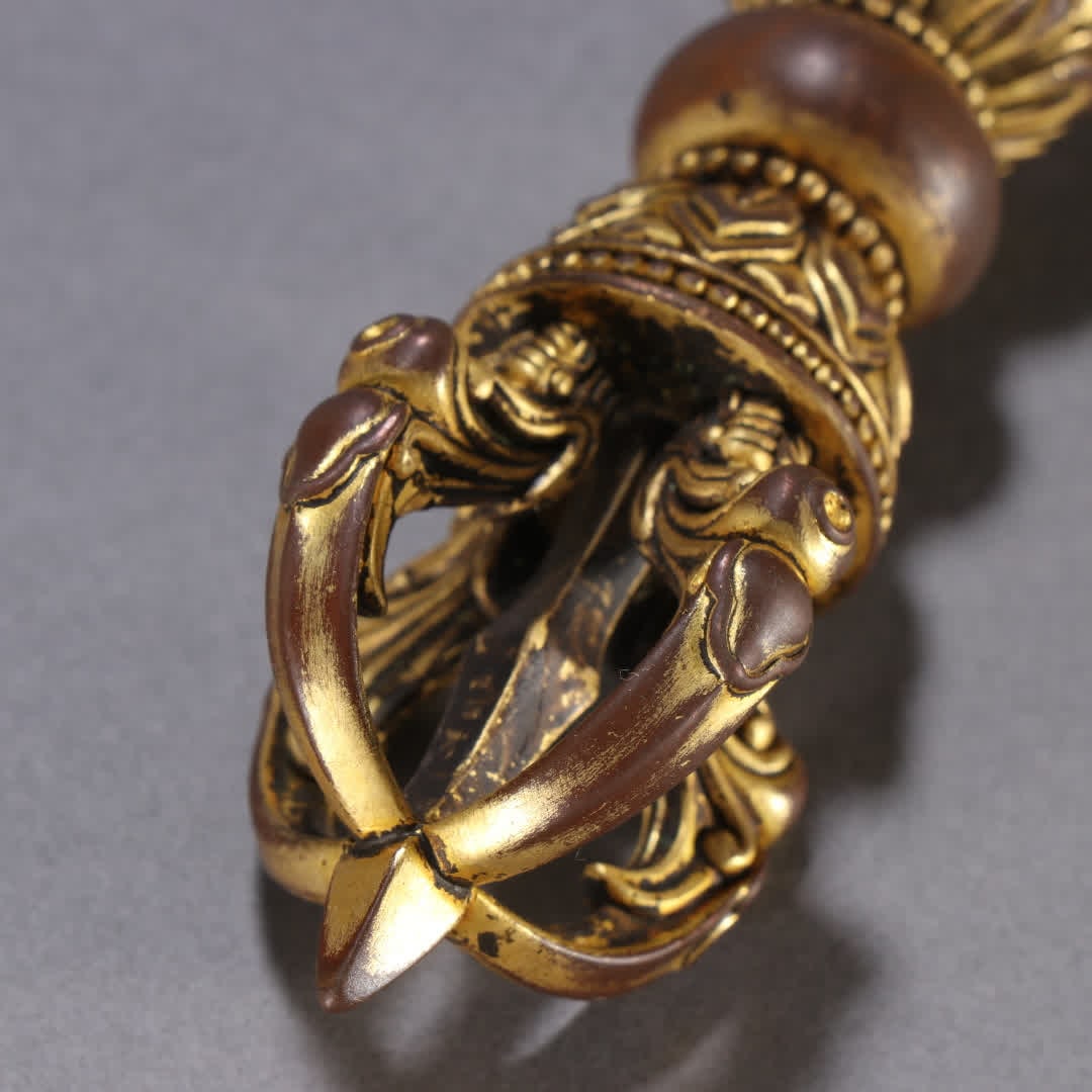 A copper gilt vajra - 9